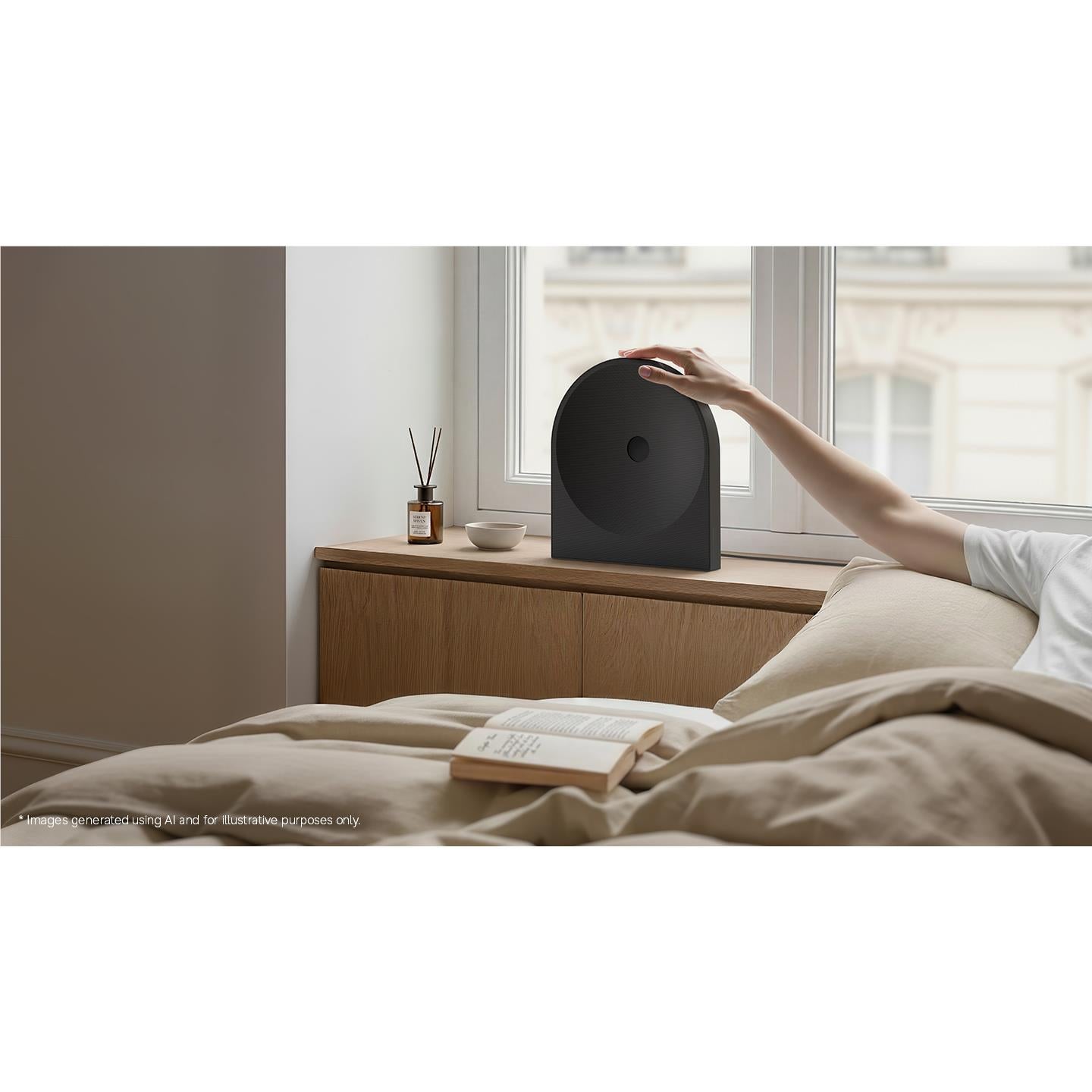 Black Wi-Fi speaker on a side table near a bed