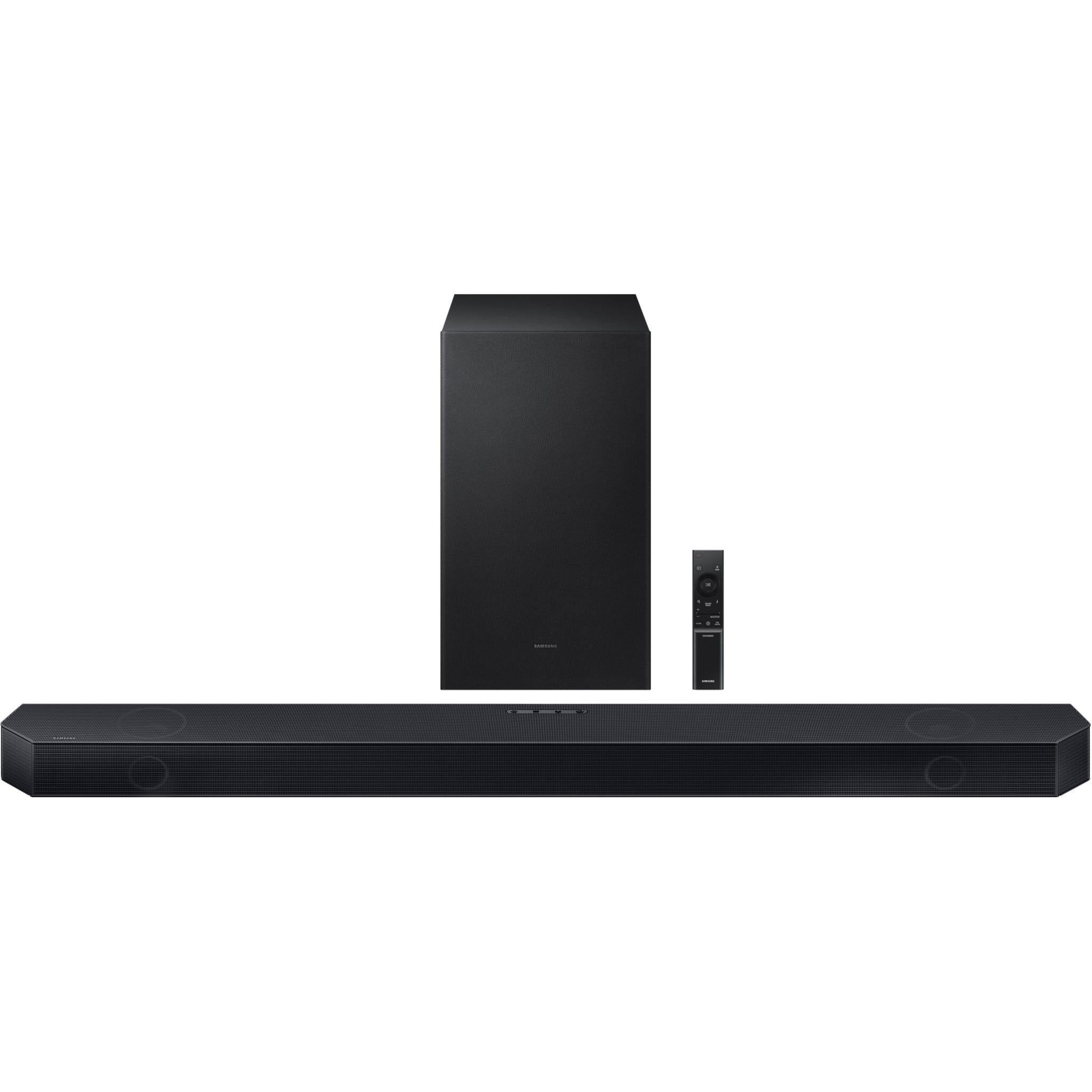 Black soundbar with wireless subwoofer standing behind it