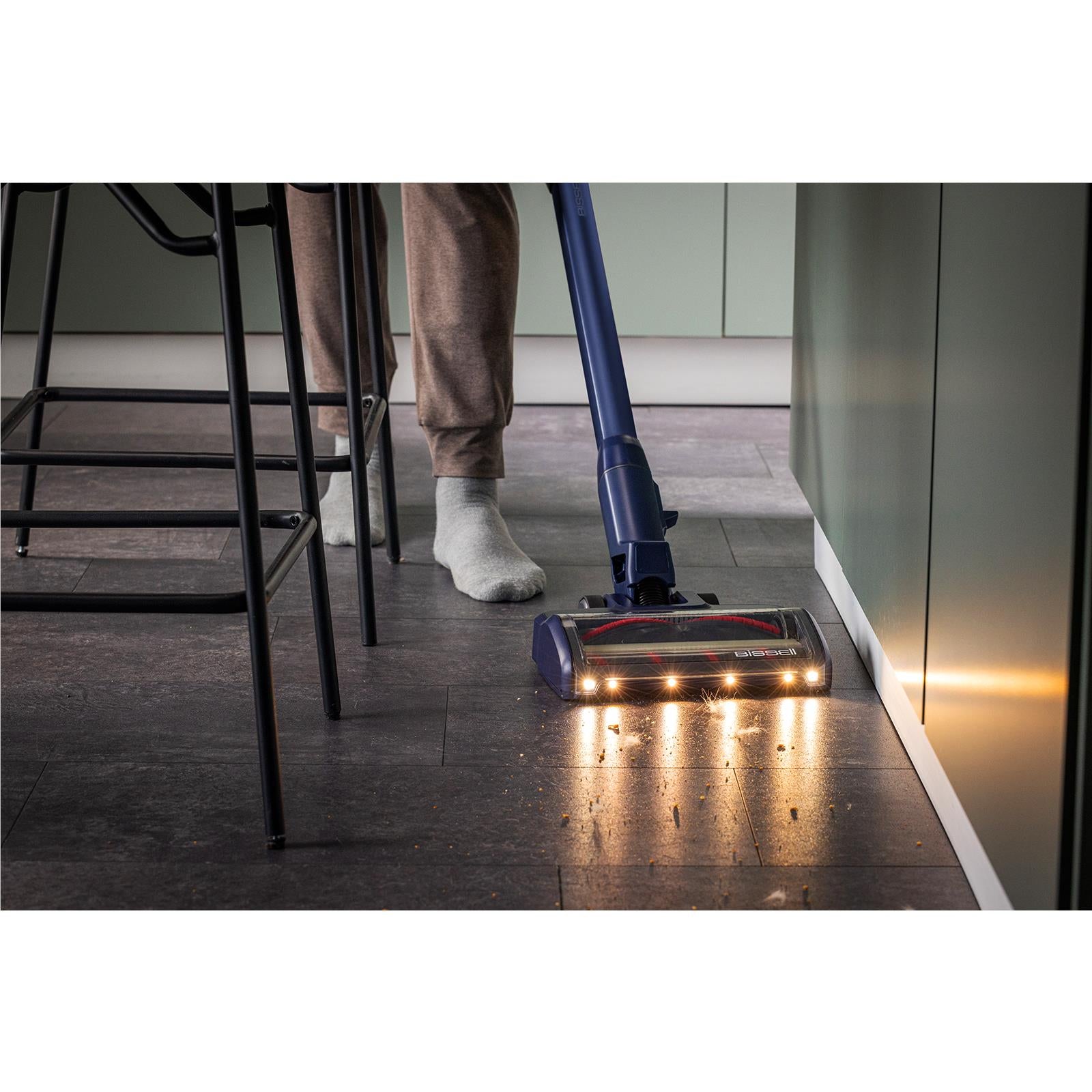 Bissell PowerClean cordless stick vacuum with lit brush head on hard floor