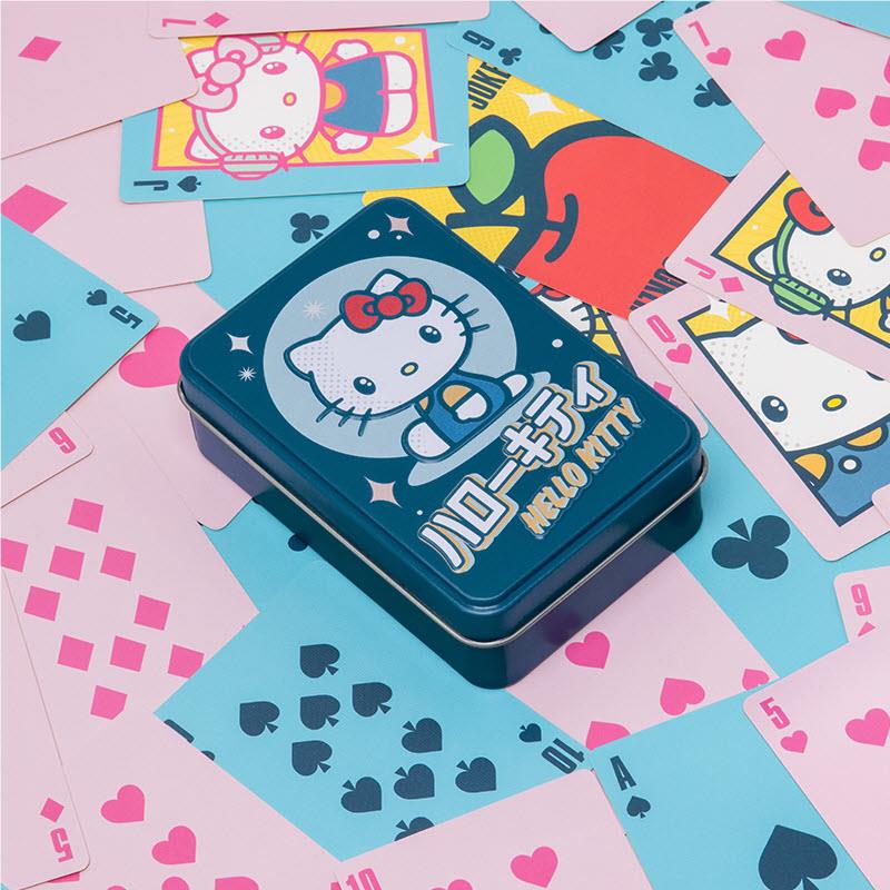 Hello Kitty playing cards tin box with multiple card faces laid around it
