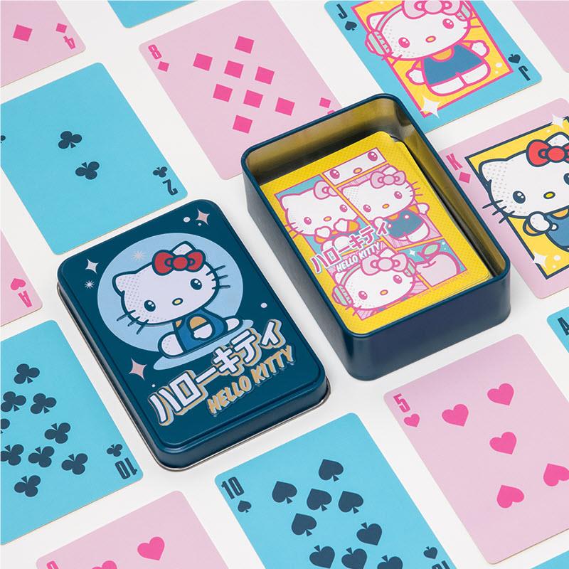 Hello Kitty playing cards with tin box and scattered suit and character cards