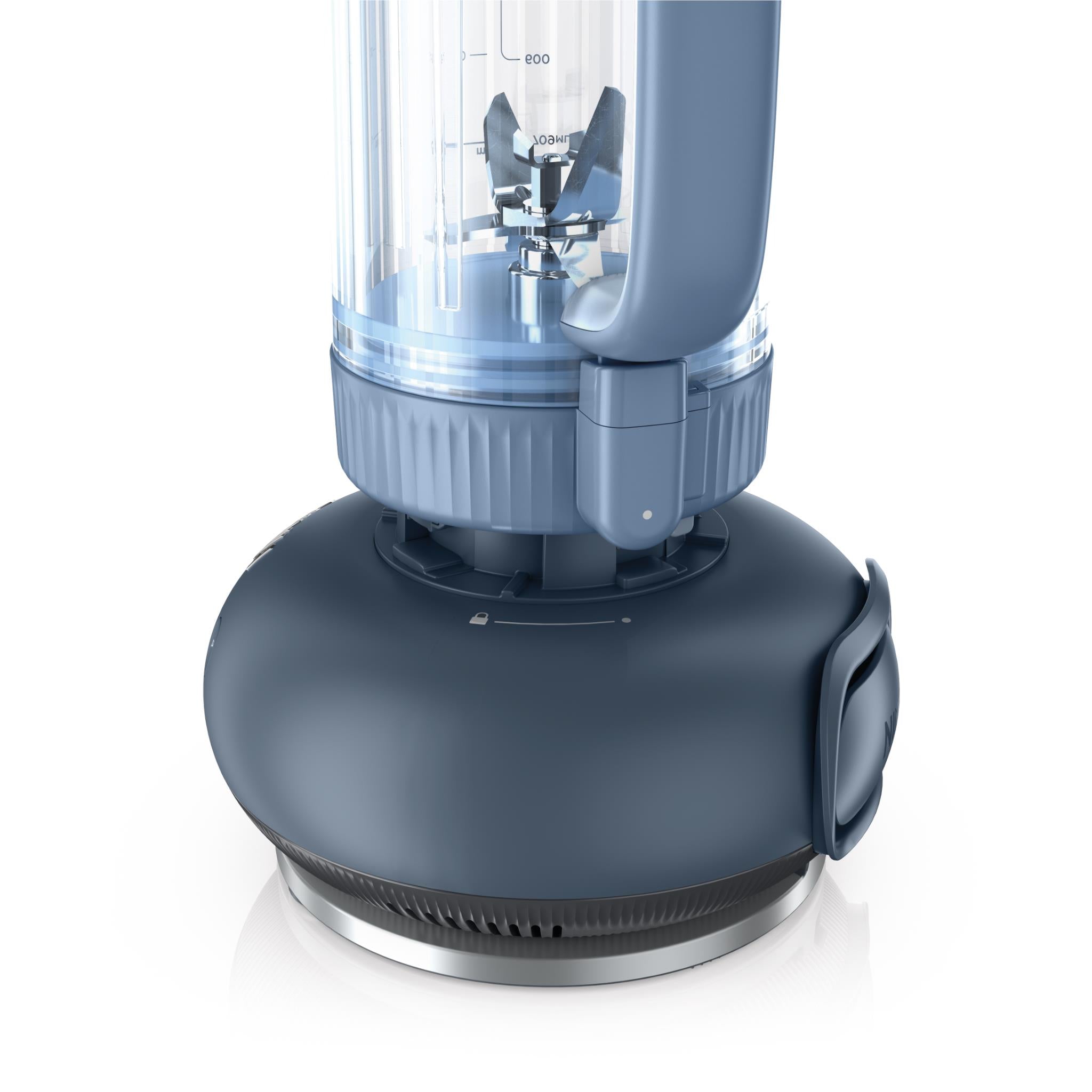 Ninja tumbler blender with clear jar and metal blades on dark base