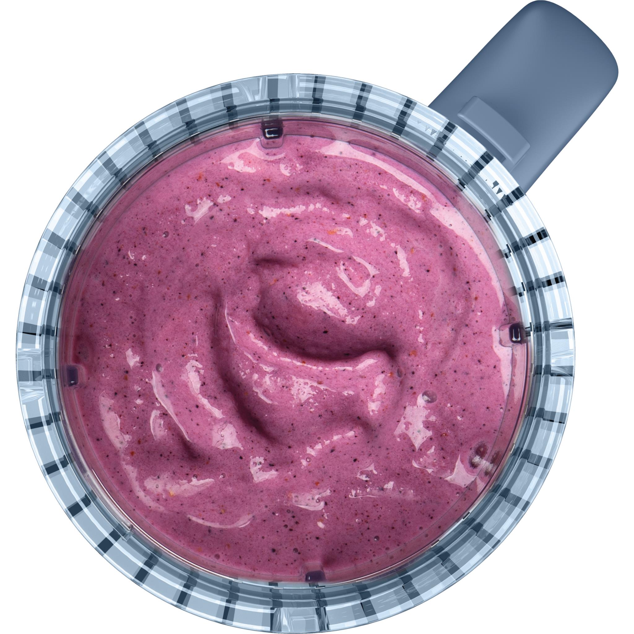 Ninja blender jar filled with thick purple smoothie with visible texture