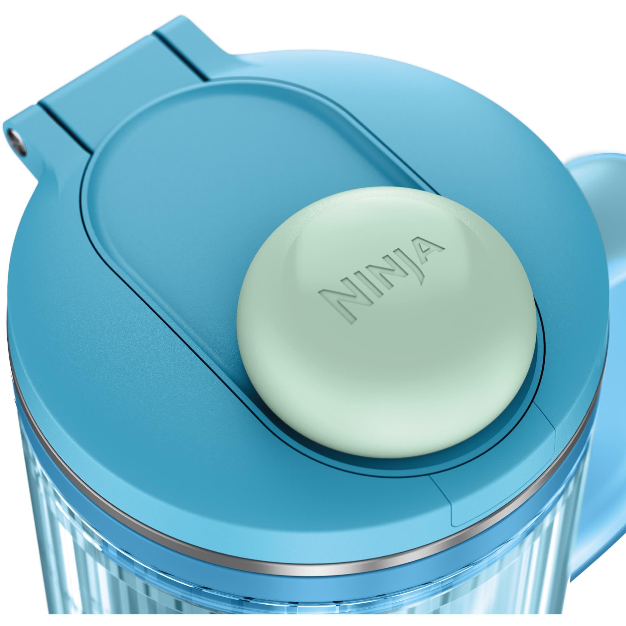 Blue blender lid with mint cap on top of clear cup