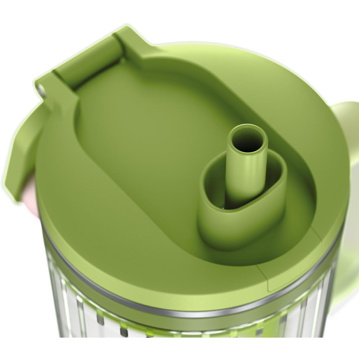 Portable blender lid underside with green feed ports