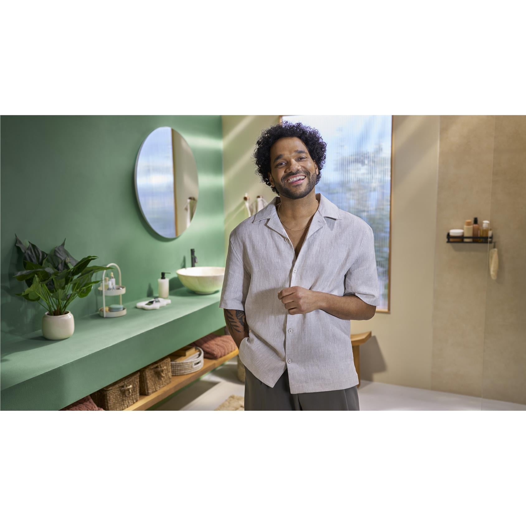Cordless multigroomer in hand for beard grooming