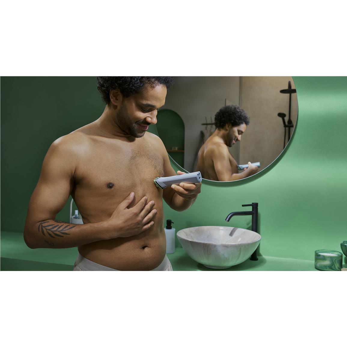 Cordless multigroomer trimming beard in bathroom