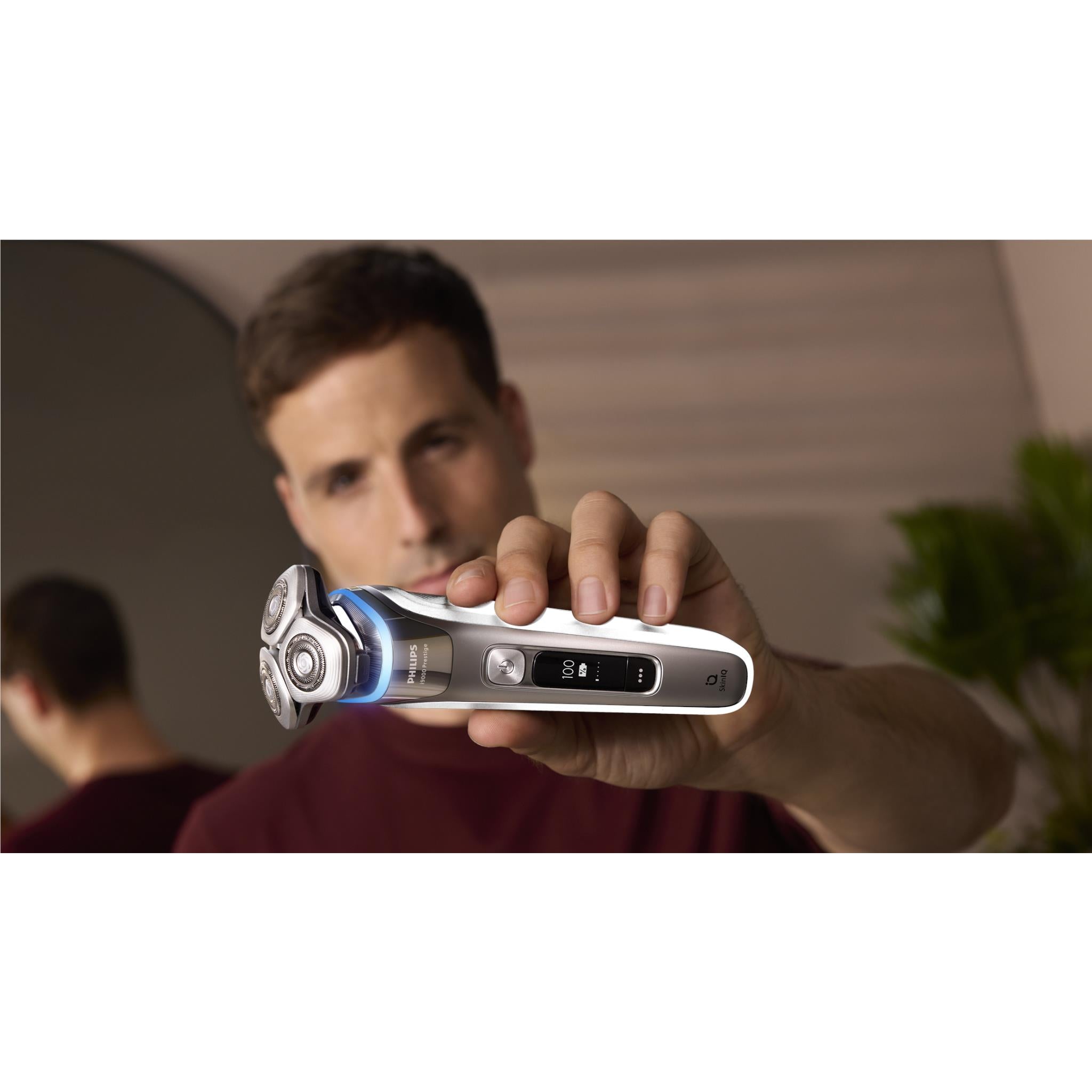 Cordless foil electric shaver, side view with display