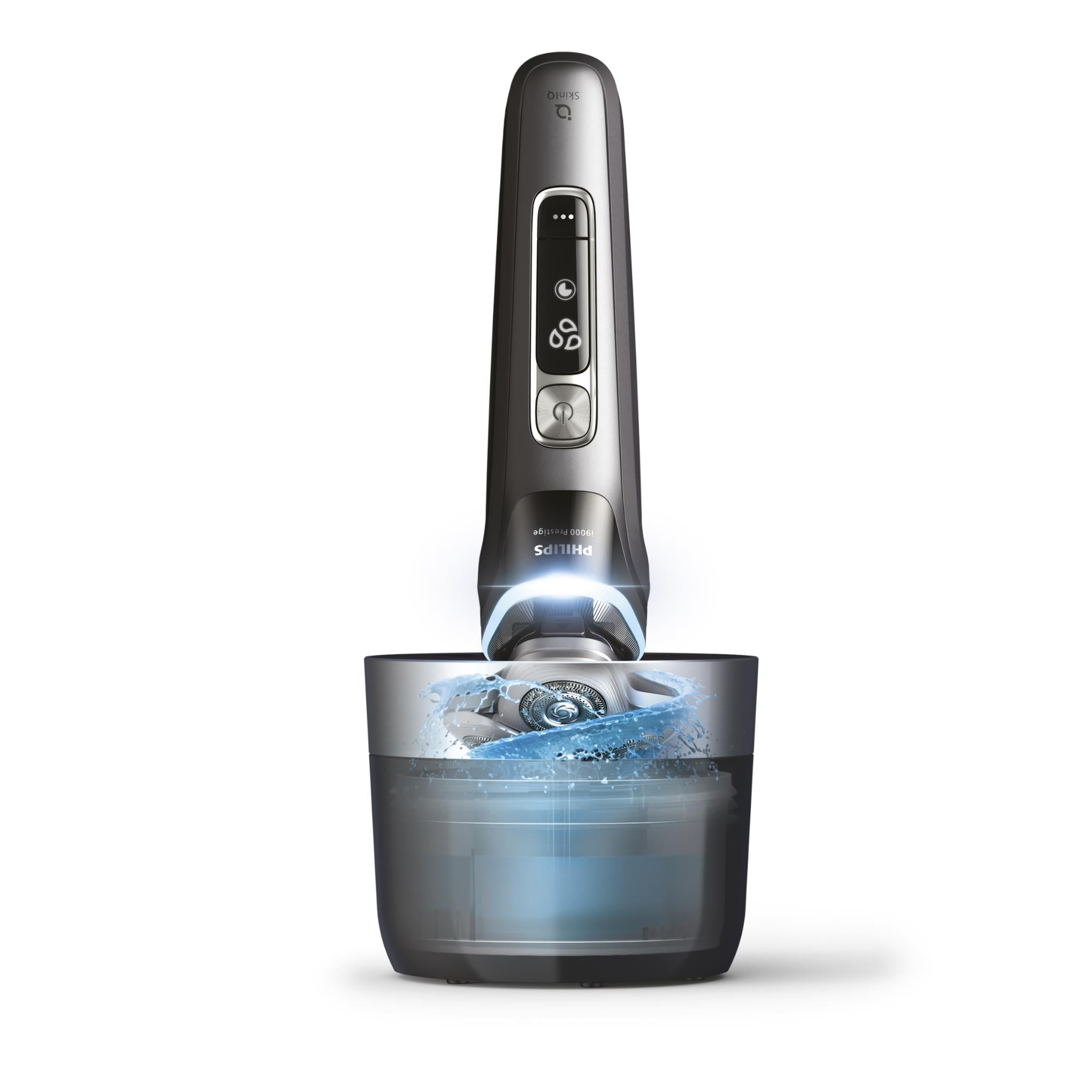 Electric shaver with charging base and water spray cleaning cycle
