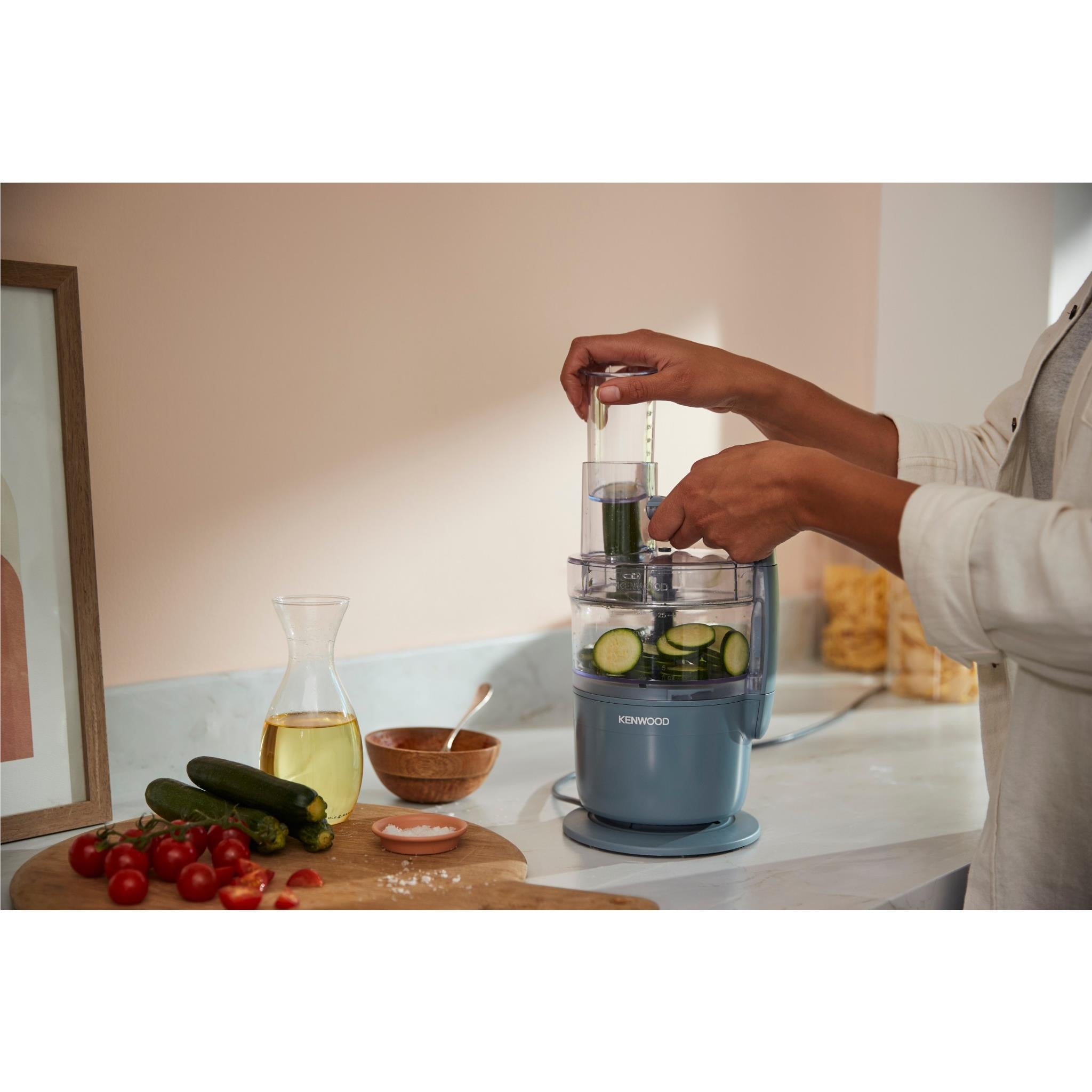 Storm Blue food processor with transparent feed tube on blender bowl