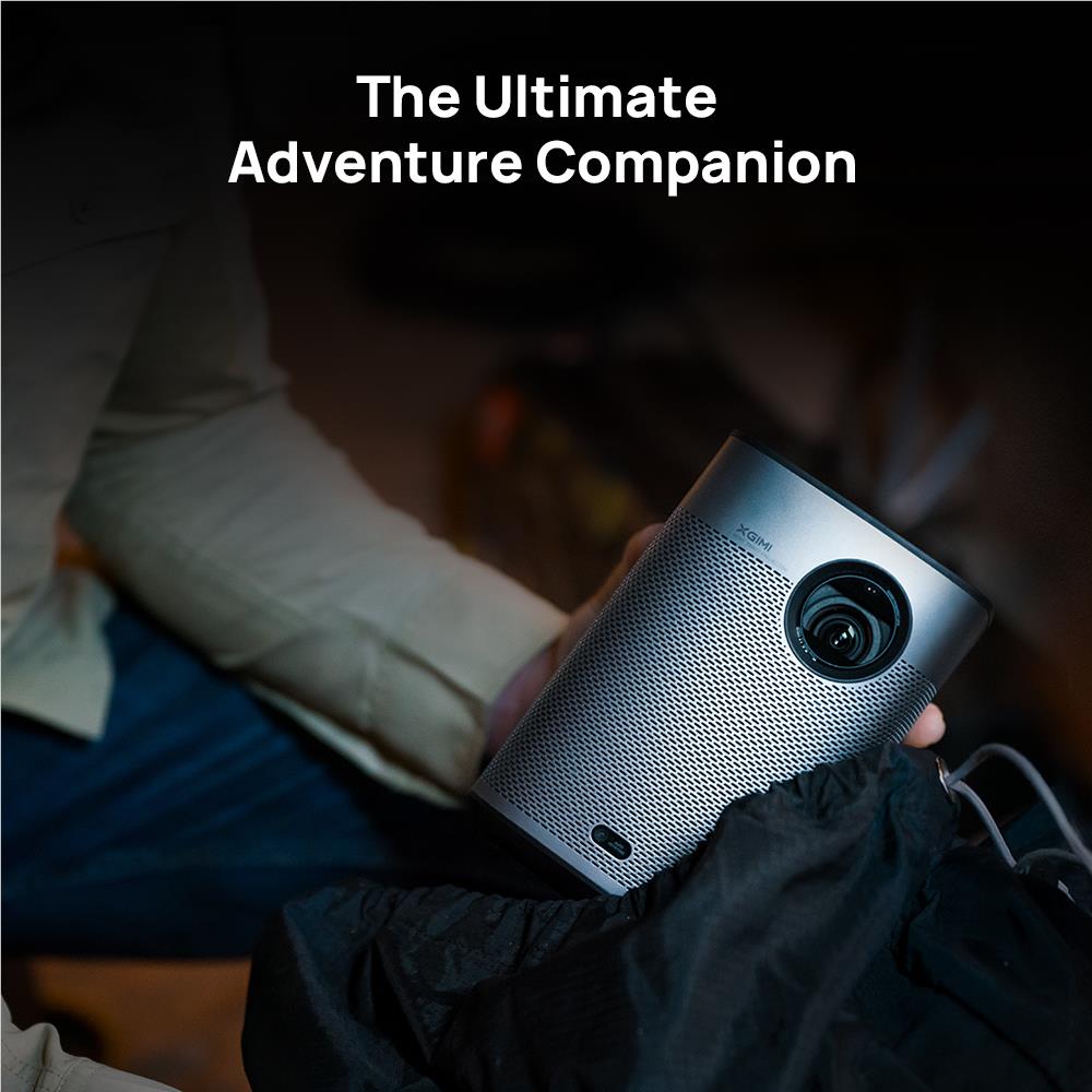 Portable XGIMI projector angled forward, showing front lens and base