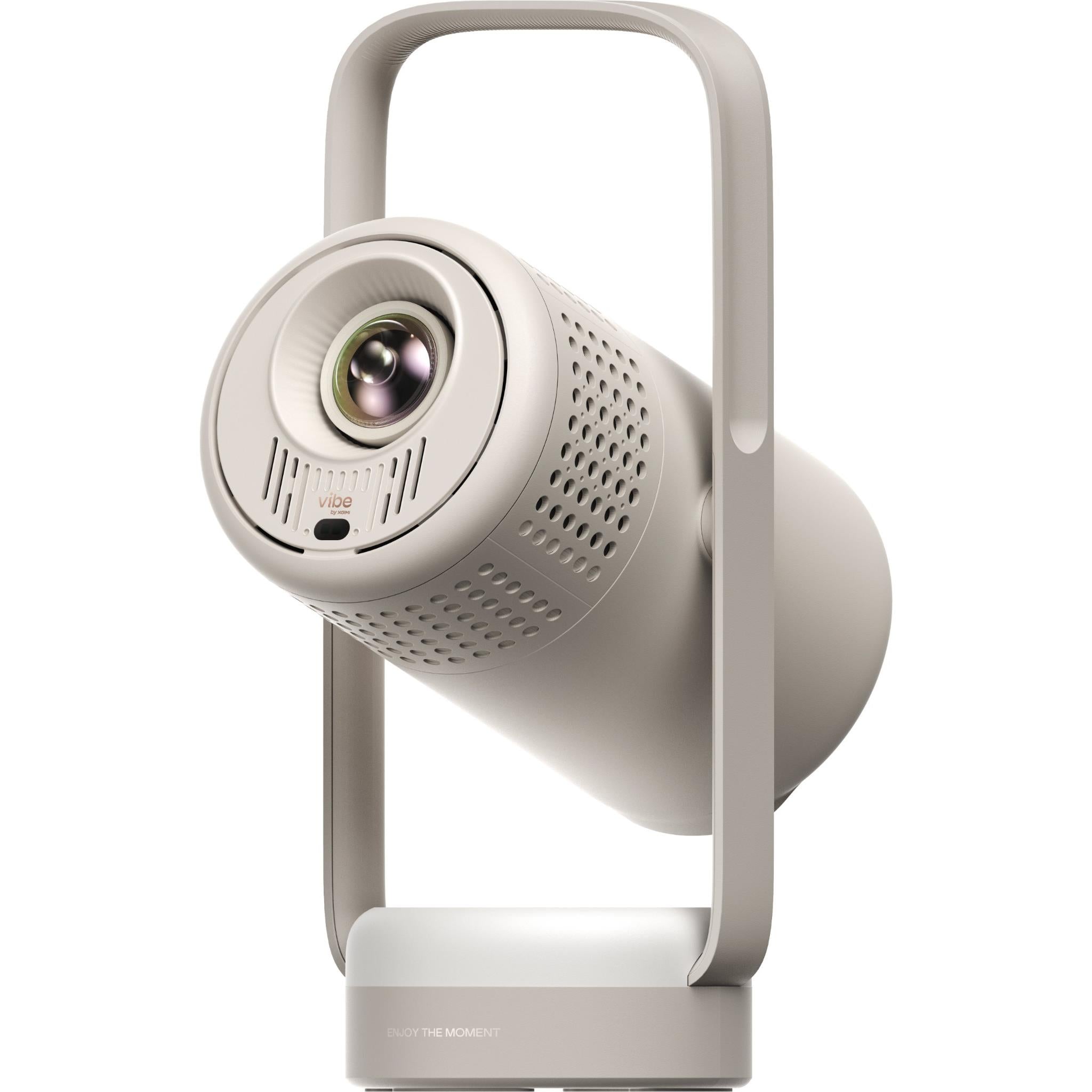 Portable projector with round lens, front speaker grille, and carrying handle; light gray/white.