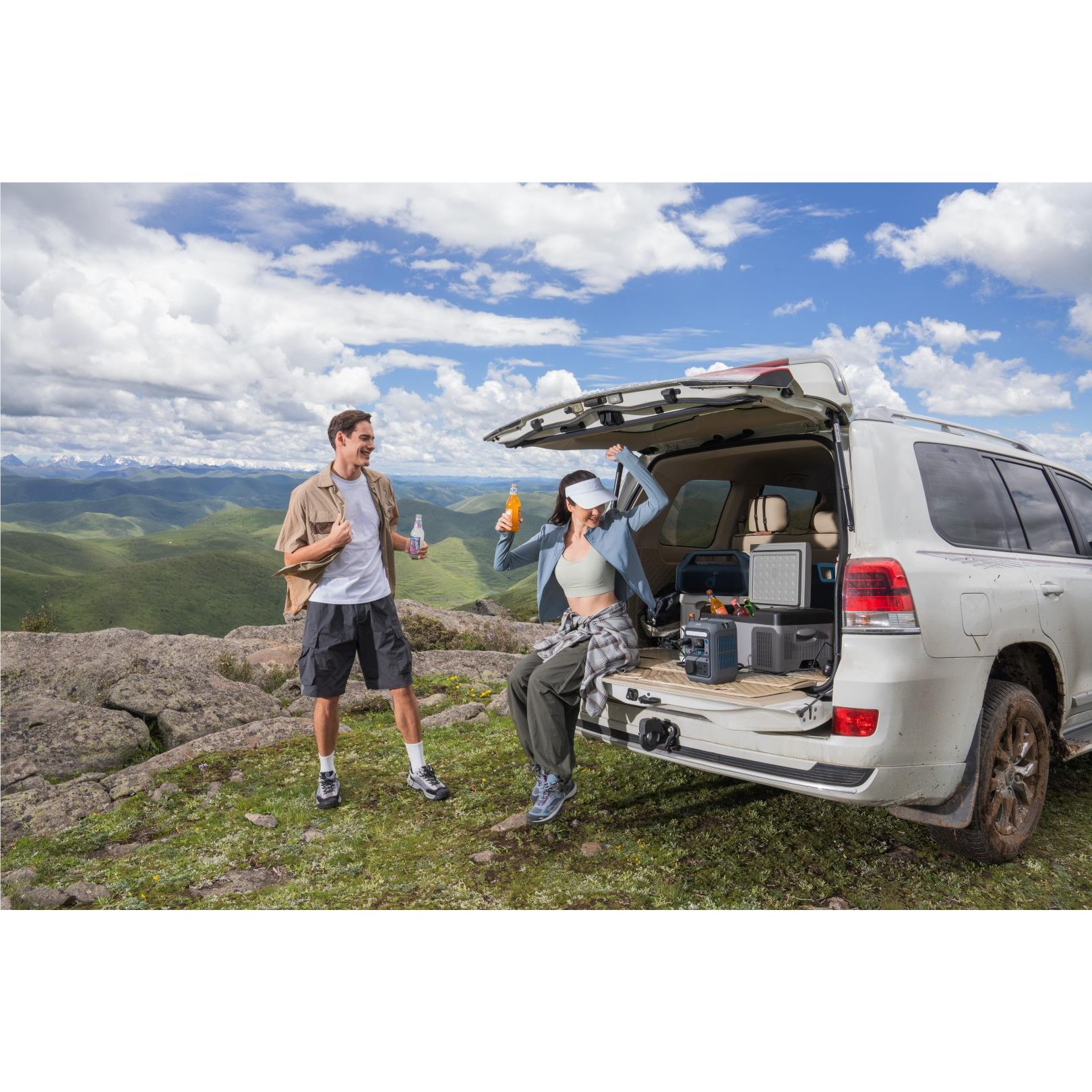 Grey Anker SOLIX power station in SUV cargo area with illuminated display