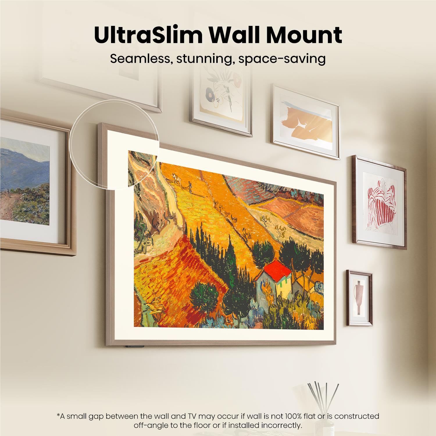 Wall-mounted slim 55-inch smart TV displaying outdoor landscape art