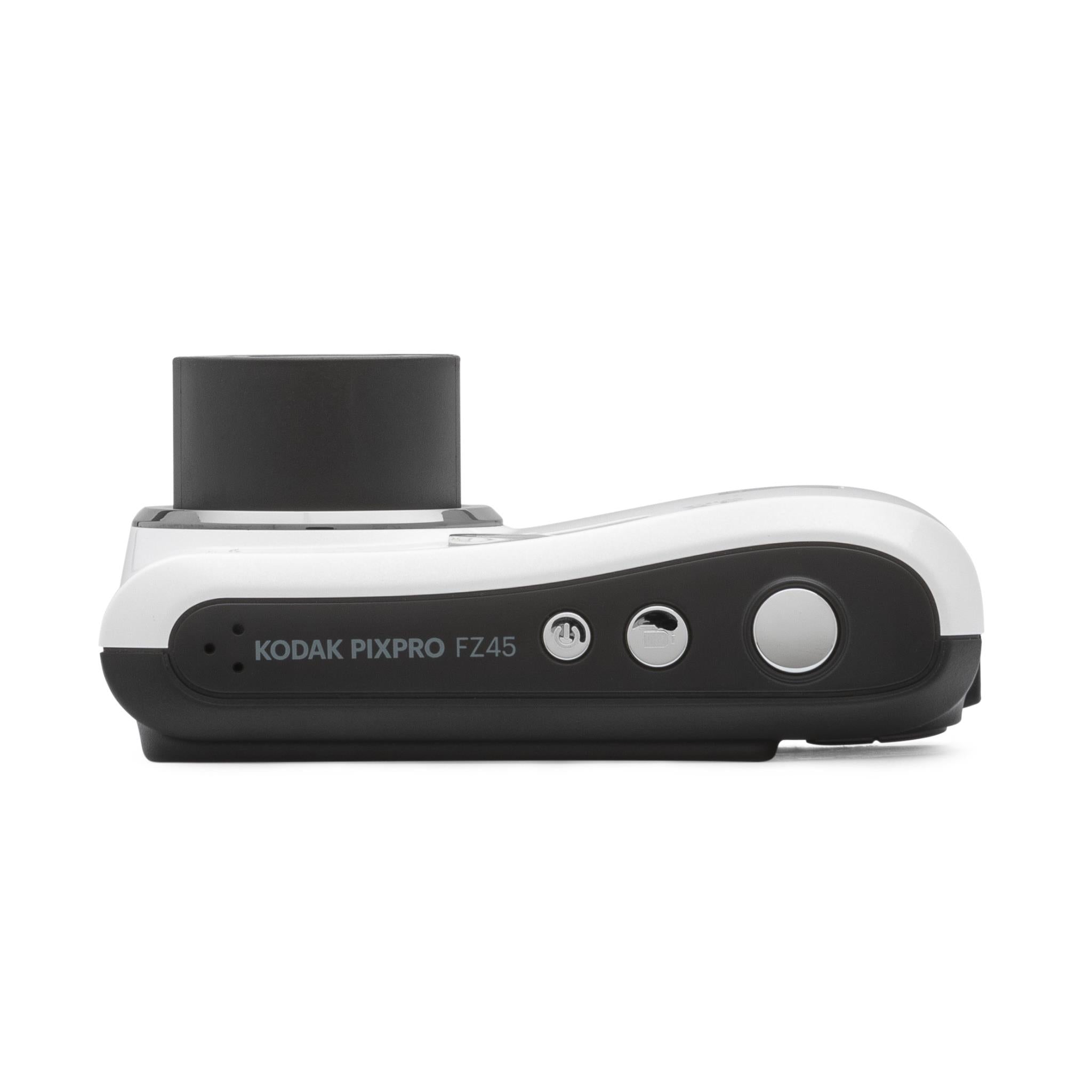 White and black compact digital camera side view with top controls