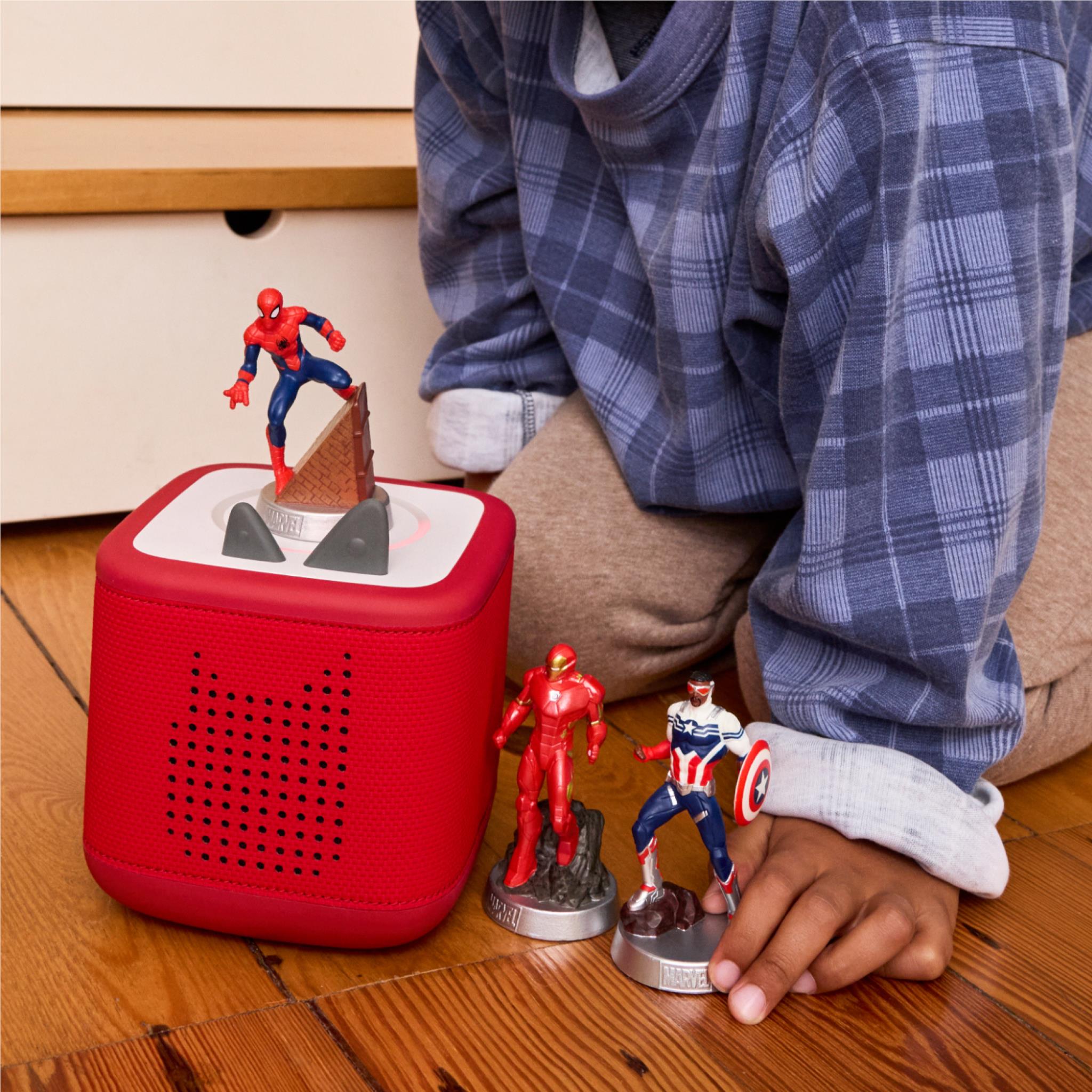 Red Tonie speaker with Iron Man figure and Captain America mini figure near hands