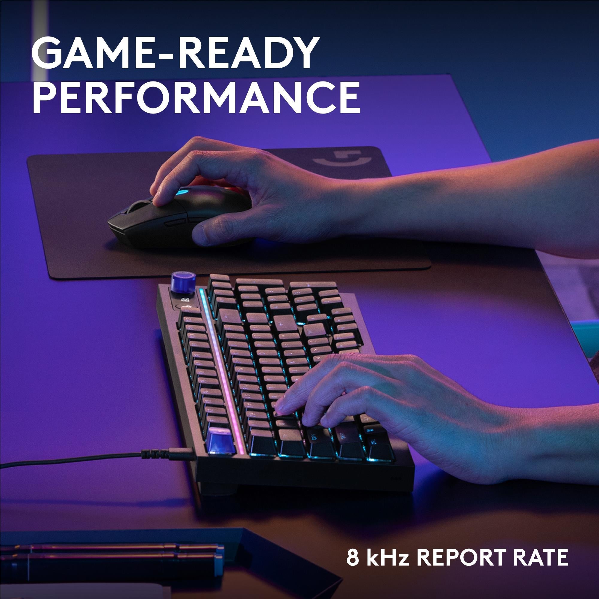 Black wired mechanical gaming keyboard on desk with RGB keys and visible cable