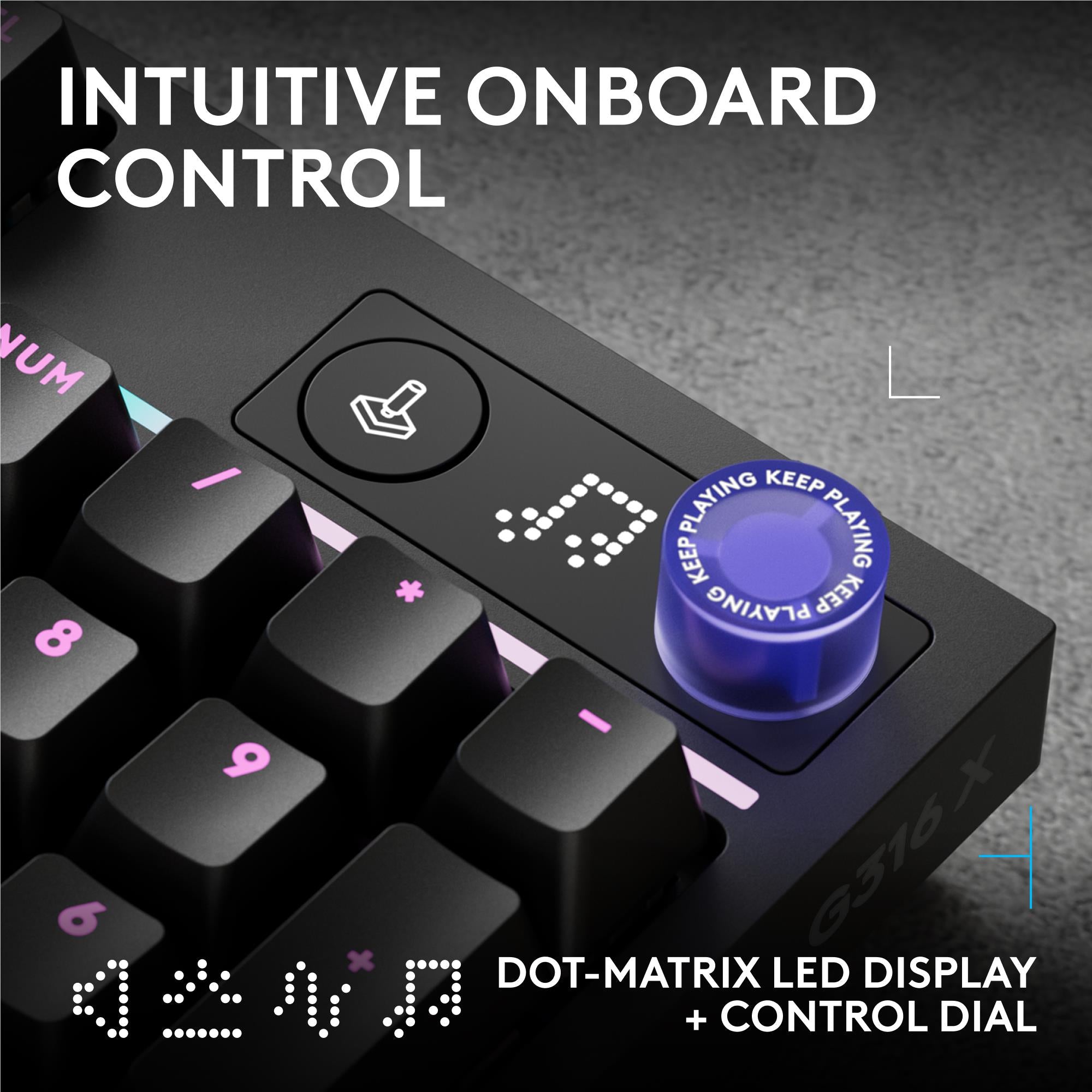 Black keyboard top-left area with dot-matrix LED display and control dial