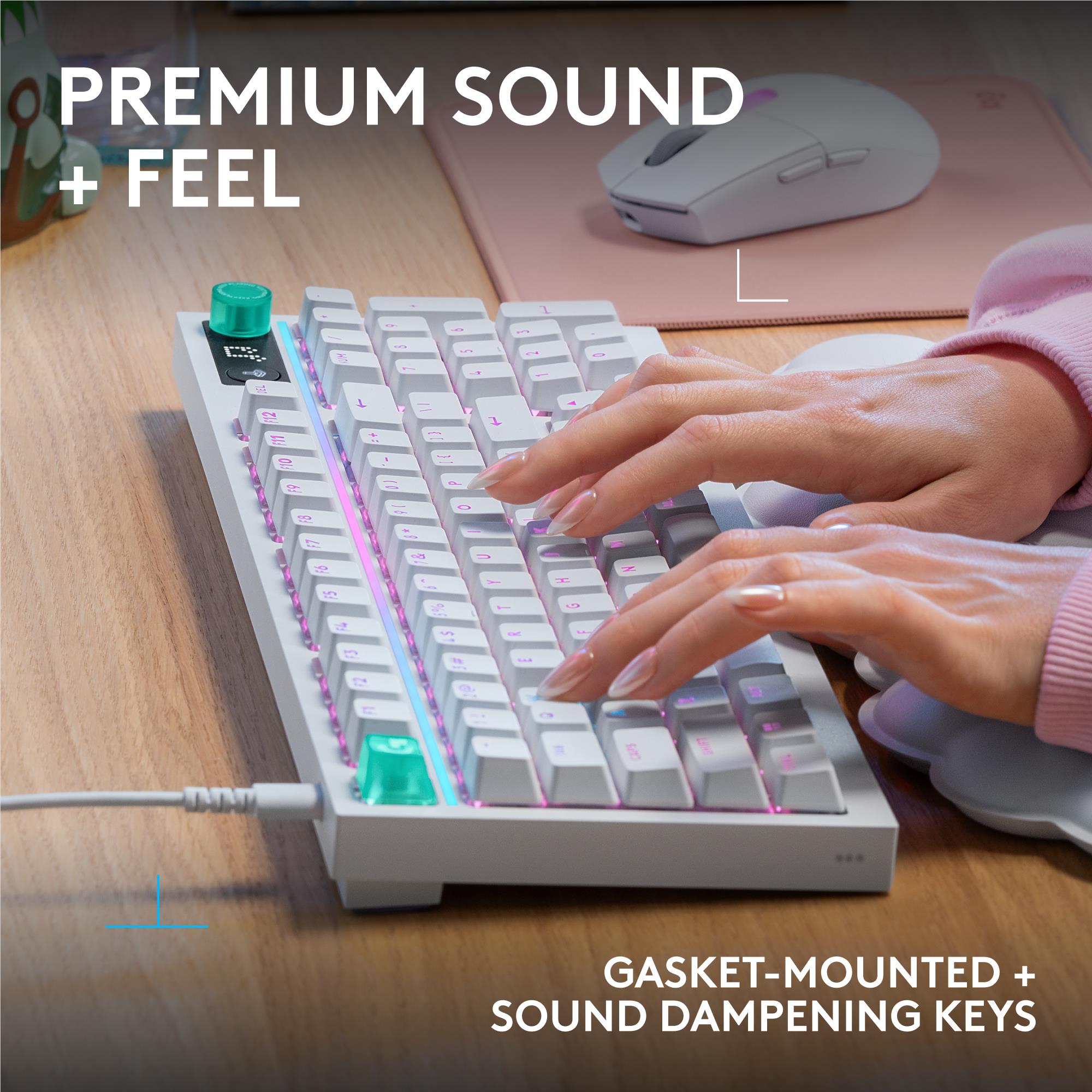 White mechanical gaming keyboard with RGB backlighting and hands on the keys