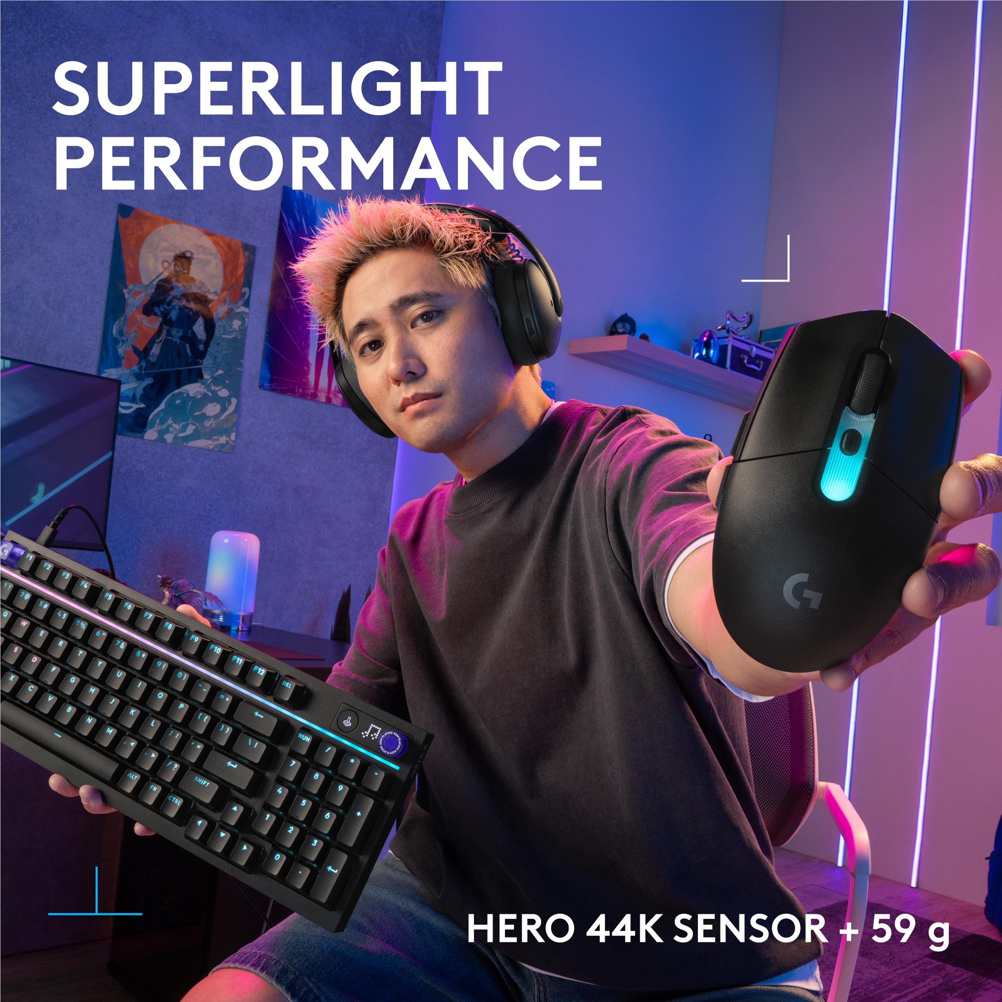 Black lightweight gaming mouse held in hand, blue light indicator glowing on top.