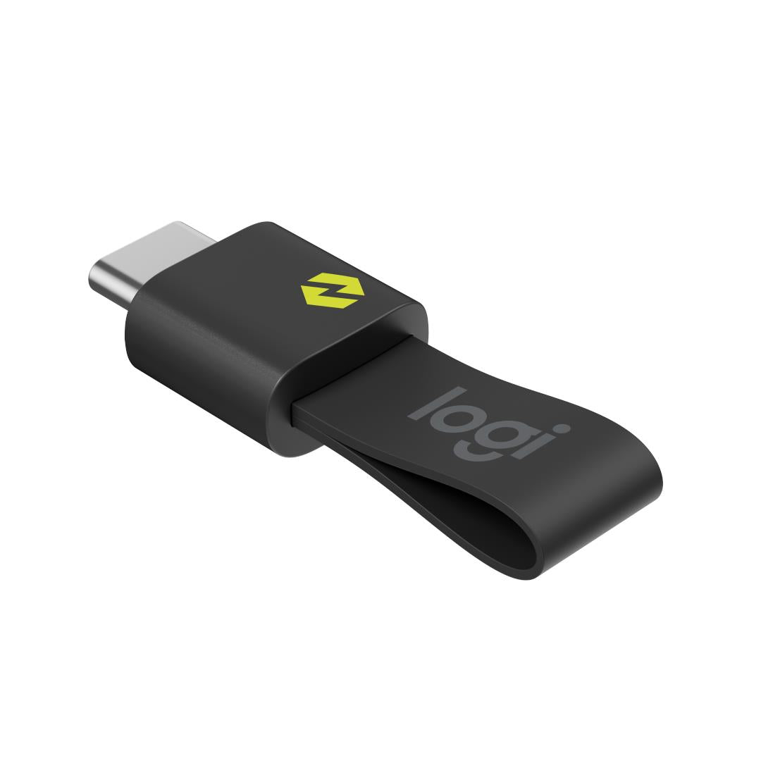 Graphite Logitech Spotlight 2 remote with USB-C-style connector and yellow arrow mark