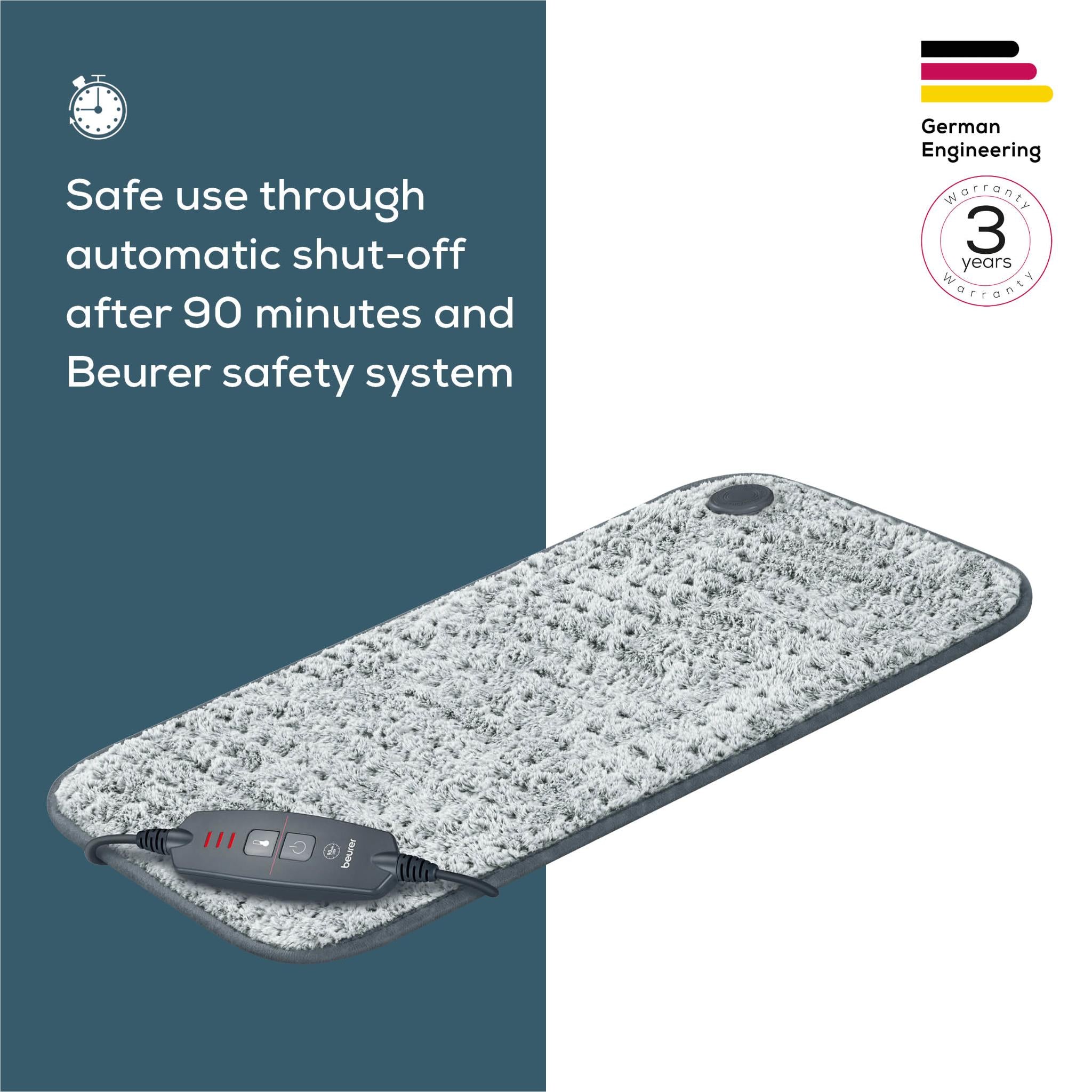 Grey fabric heating pad with controller module attached and round sensor on top