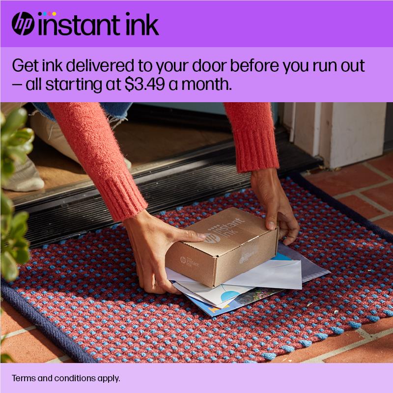 Instant Ink delivery box on doormat with mail and packaging
