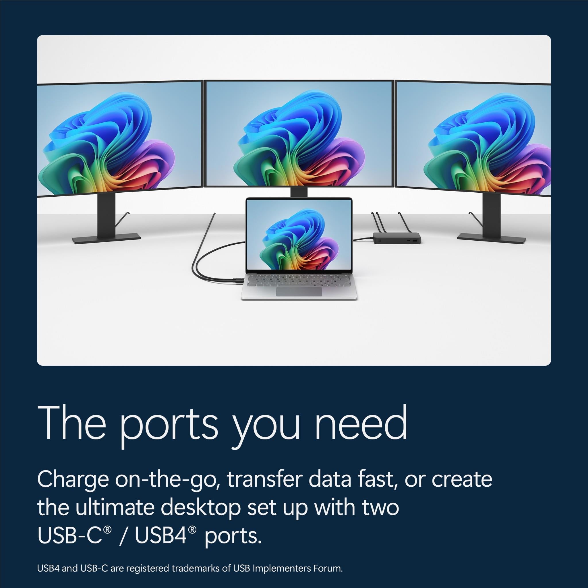 Multiple laptops on a stand setup with screens showing colorful wallpapers