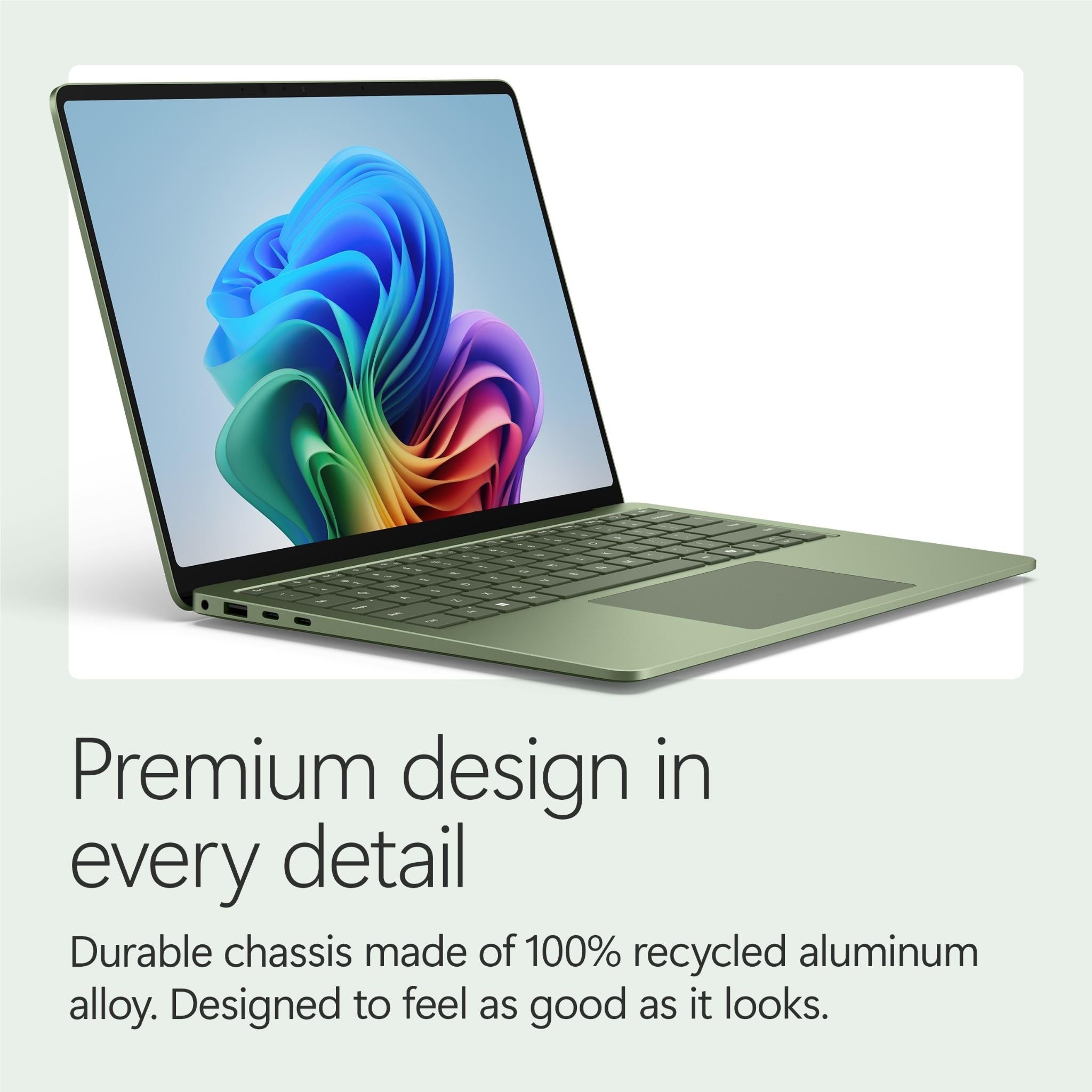 Jade Surface Laptop on white background, open screen and keyboard visible