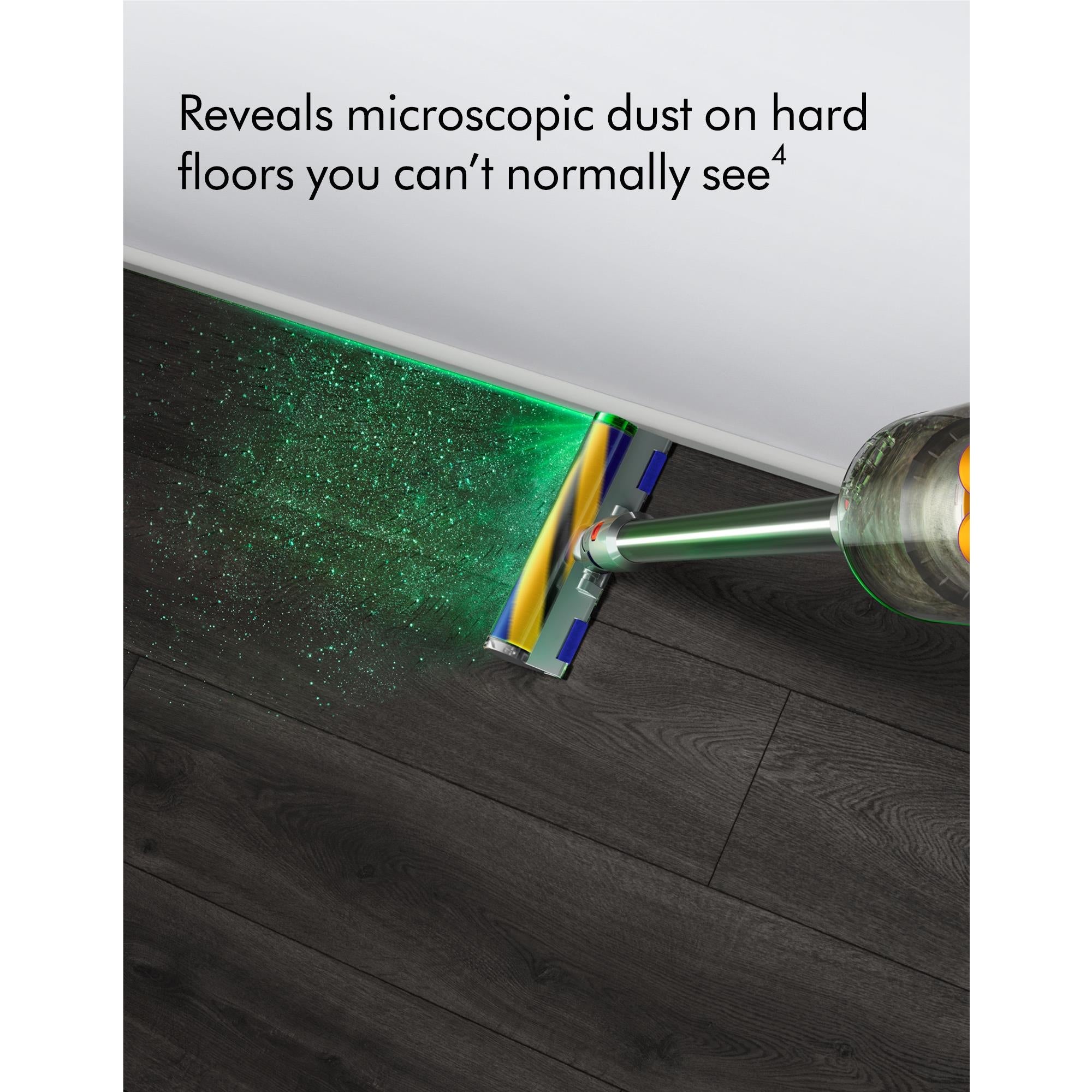 Dyson cordless stick vacuum showing dust pickup on hard floor