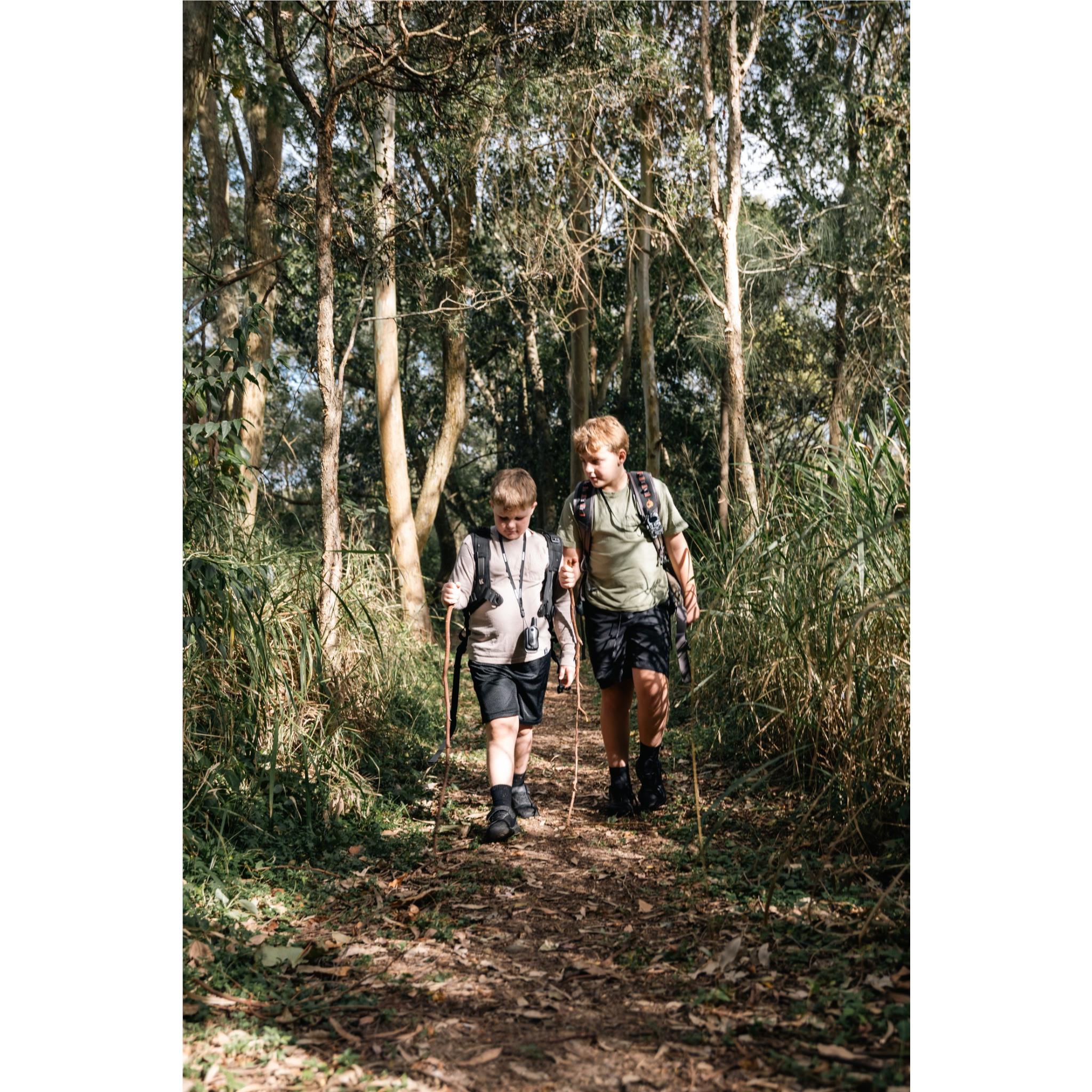 Children walking with Uniden Kid-Zone Plus UHF radios