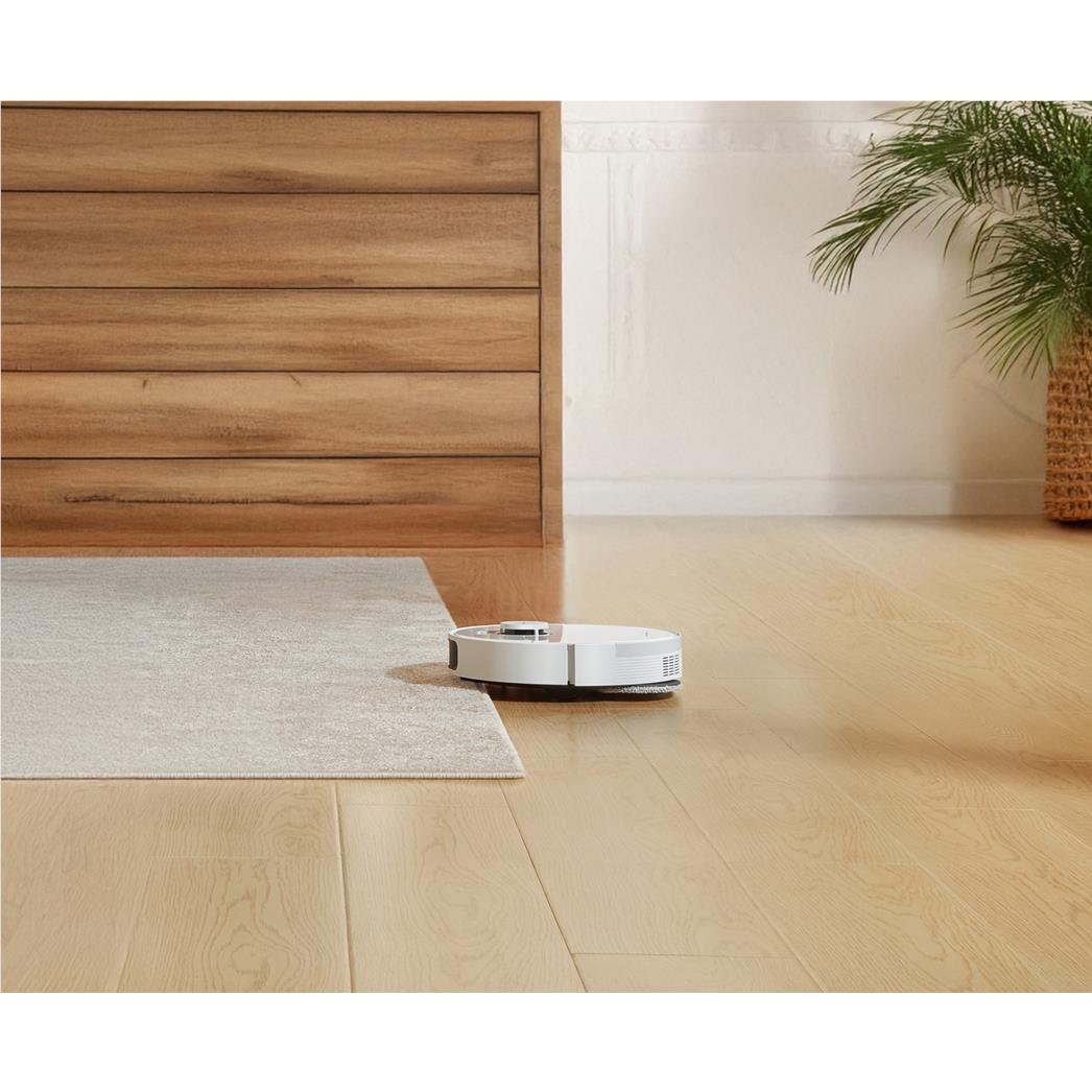 Dreame robot vacuum and mop on hardwood floor beside gray area rug