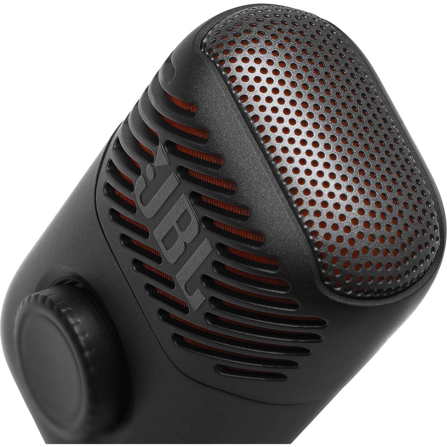 Close-up of black JBL mini karaoke microphone speaker grille and orange accents