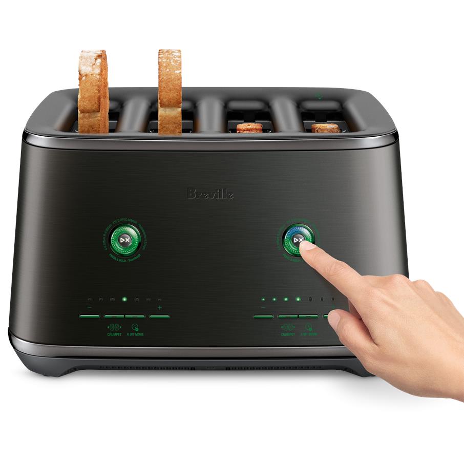 4-slice toaster with bread in slots; hand pressing a green control dial on dark body