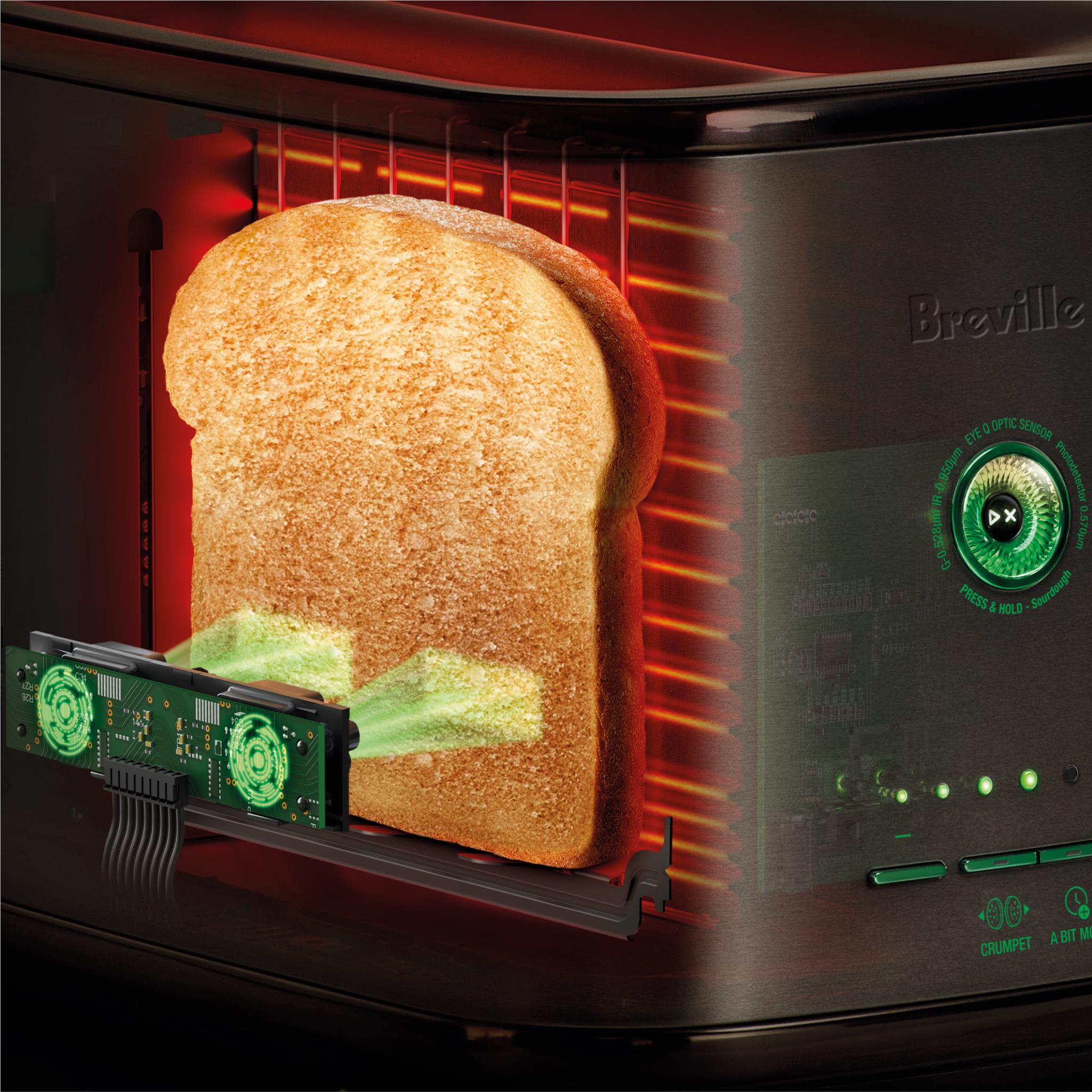 Breville 2-slice toaster with toast rising from the slots, black exterior.