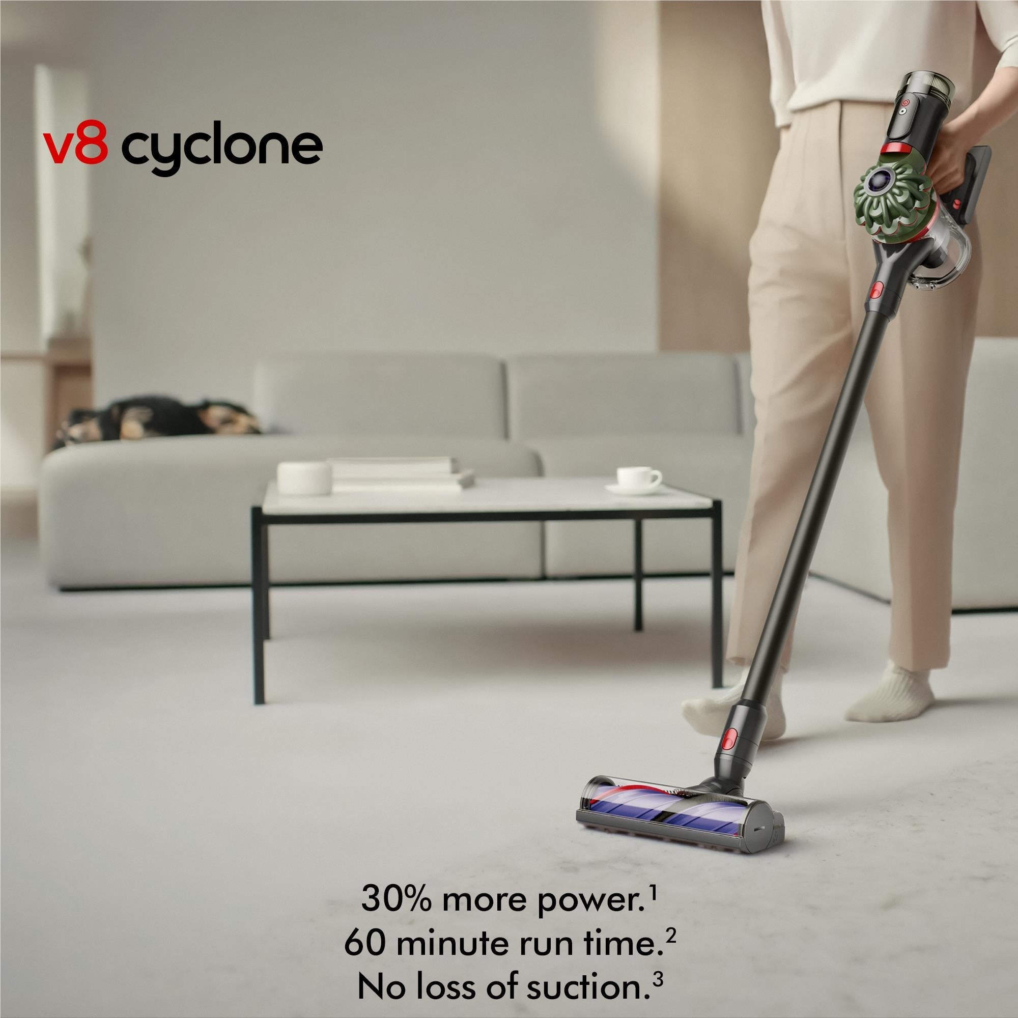 Dyson cordless stick vacuum cleaner standing upright with rotating cyclone head