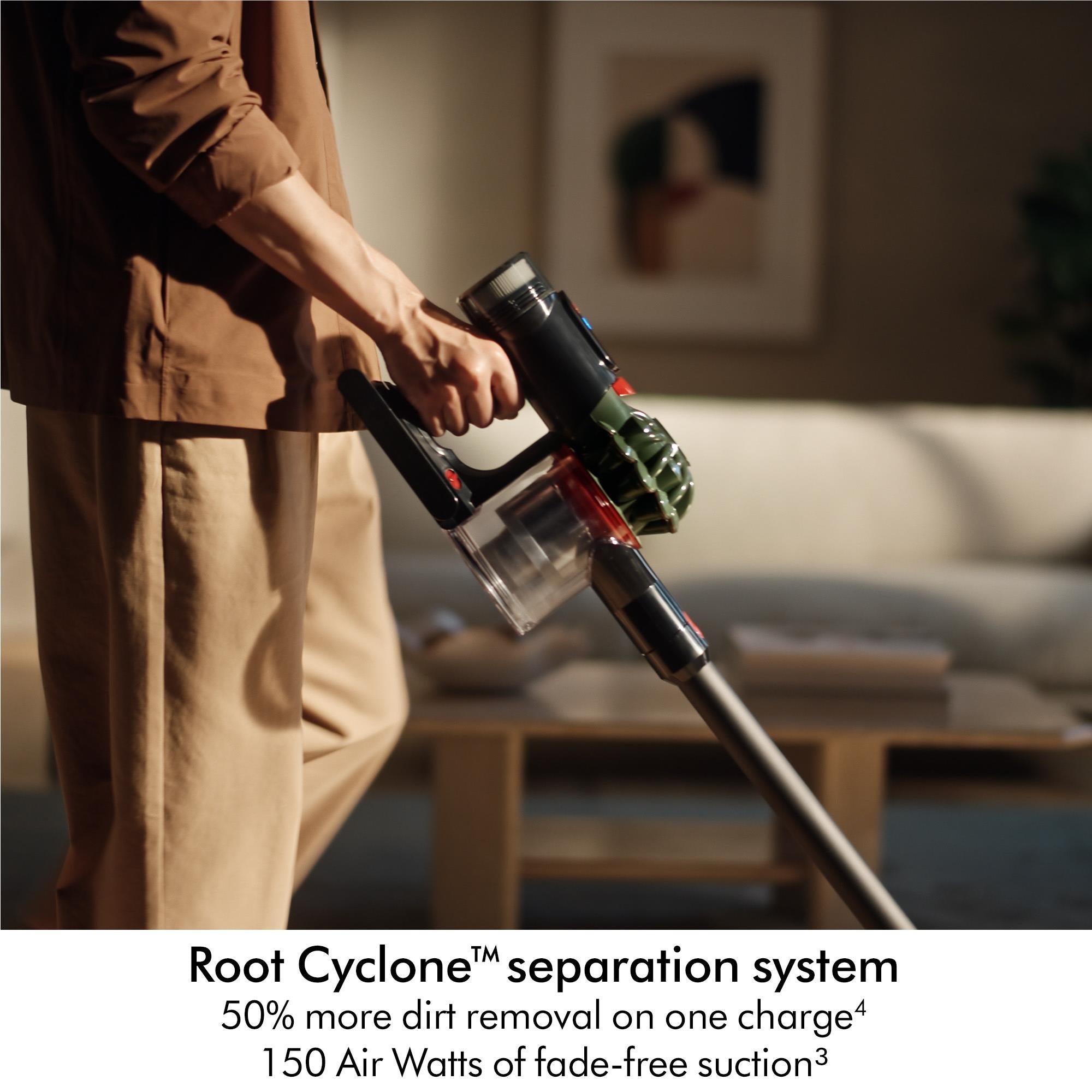 Dyson cordless stick vacuum cleaner used on upholstery with handheld cyclone tool