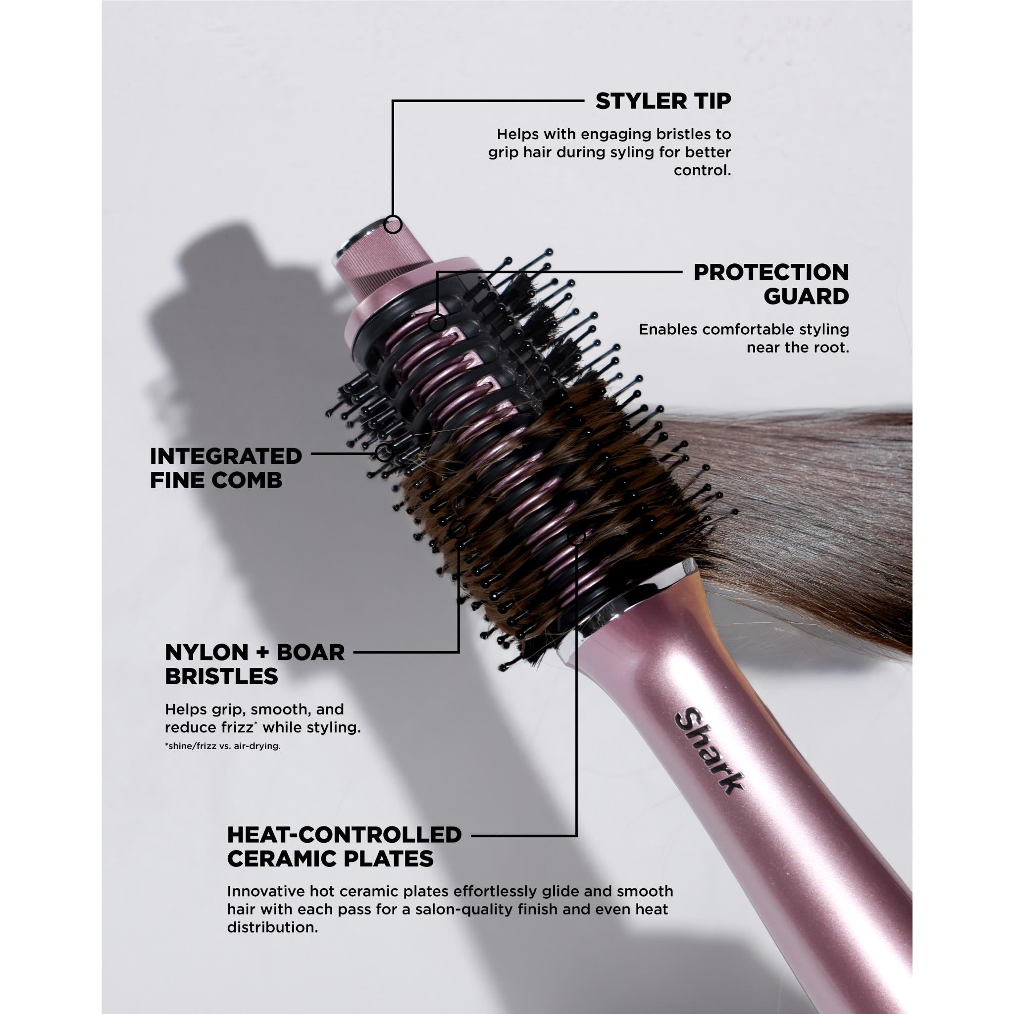 Pink hot air hair styler with round brush barrel and integrated fine comb