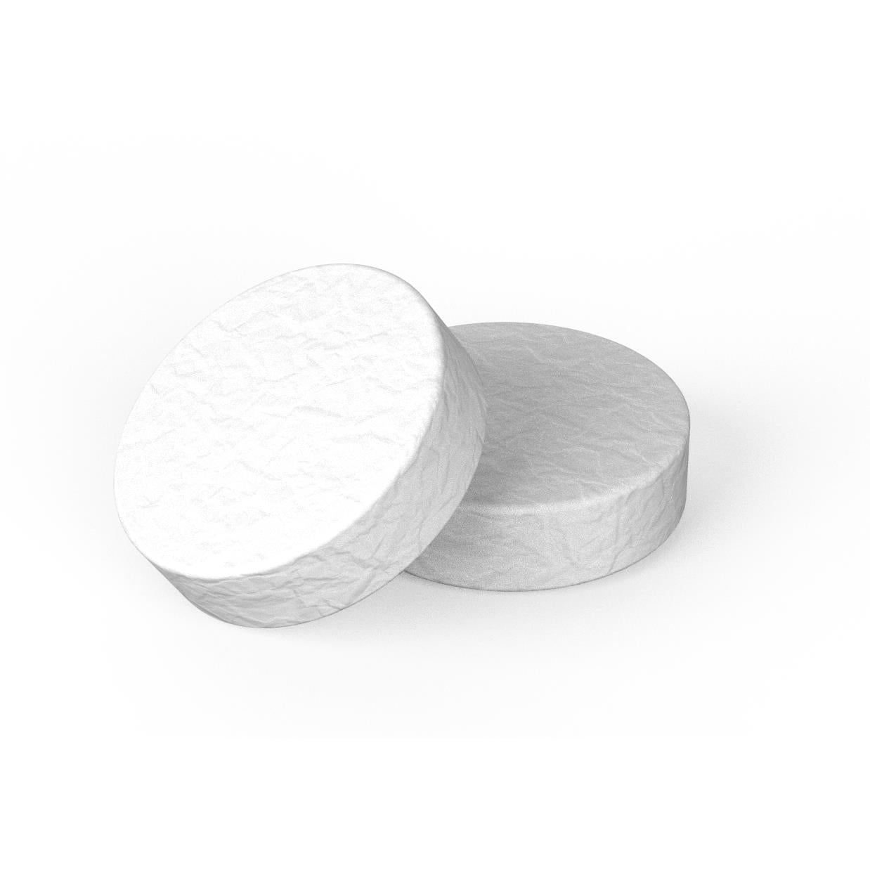 Espresso cleaning tablets, two round white tablets shown
