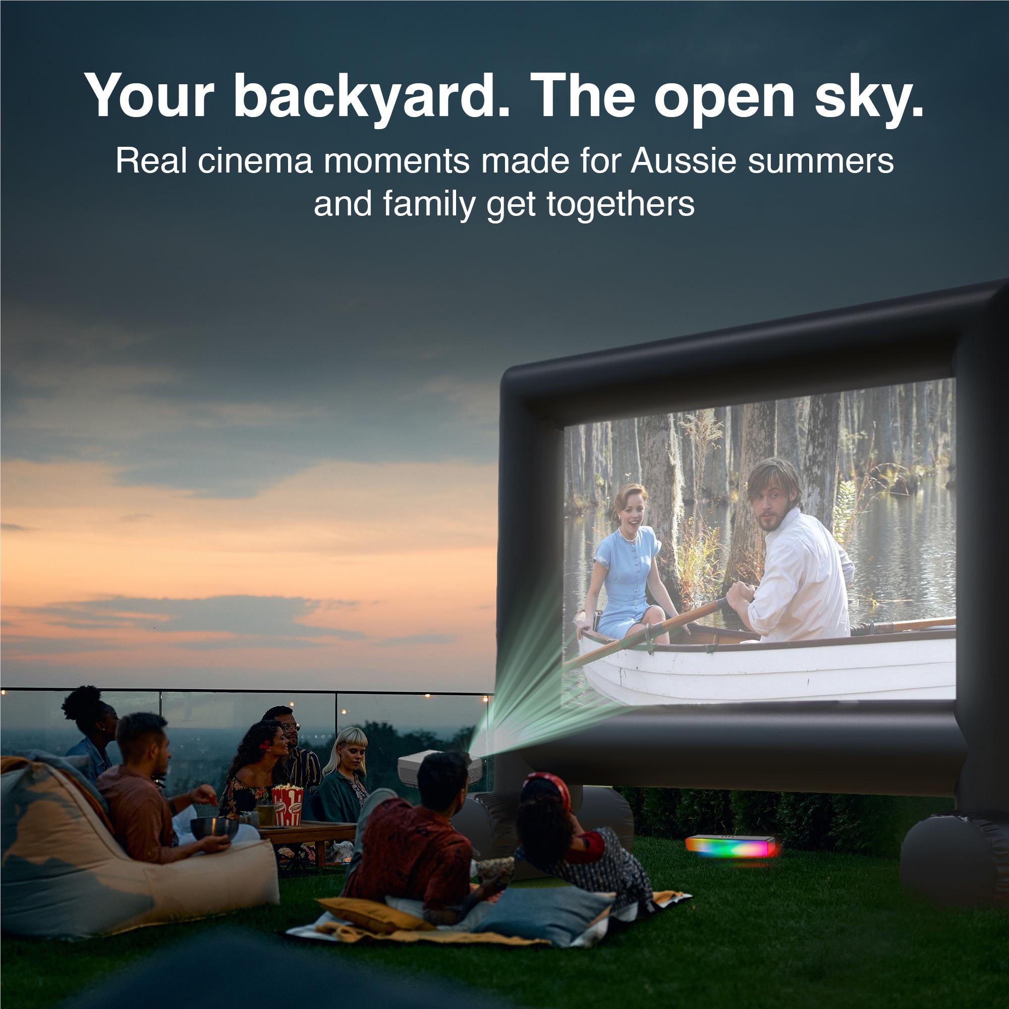 Outdoor laser cinema screen projection with projector and stand for backyard viewing
