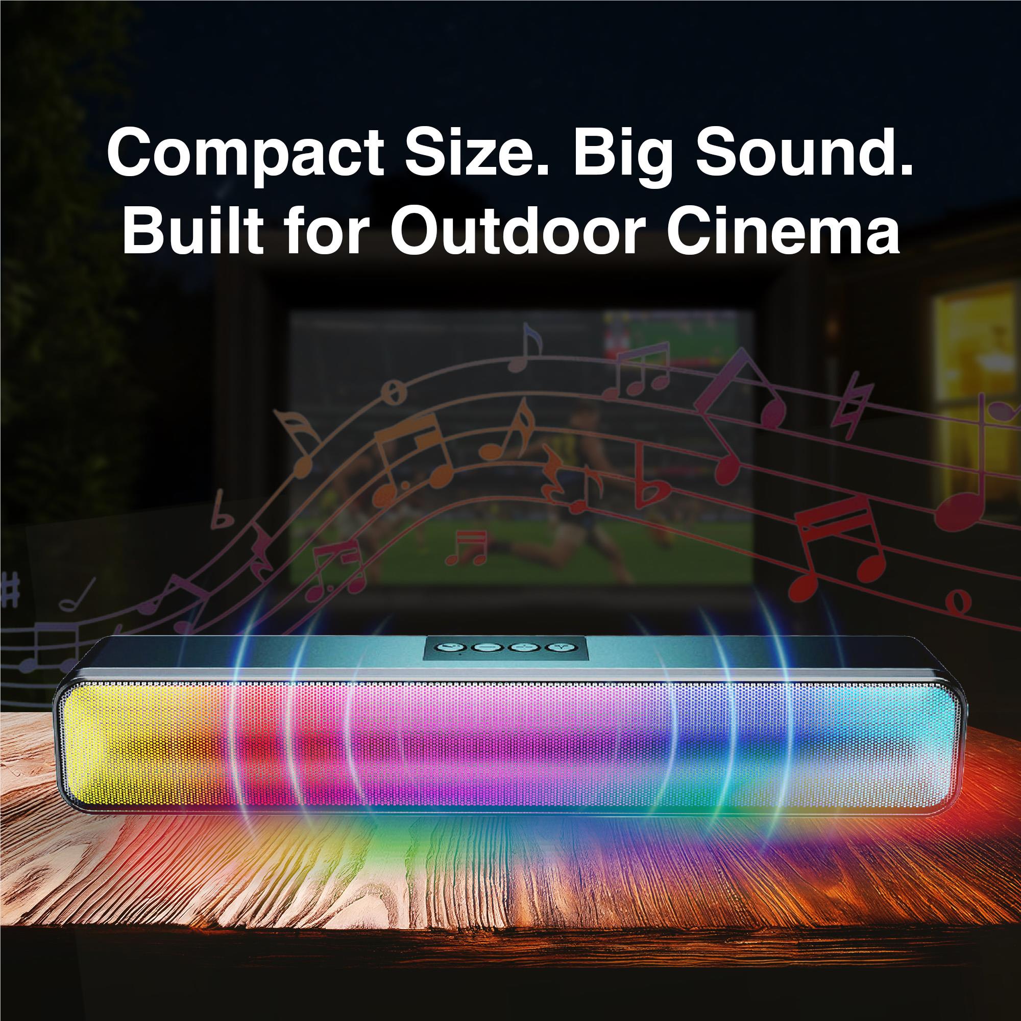 Soundbar-style speaker with colorful LED light strip on an outdoor table