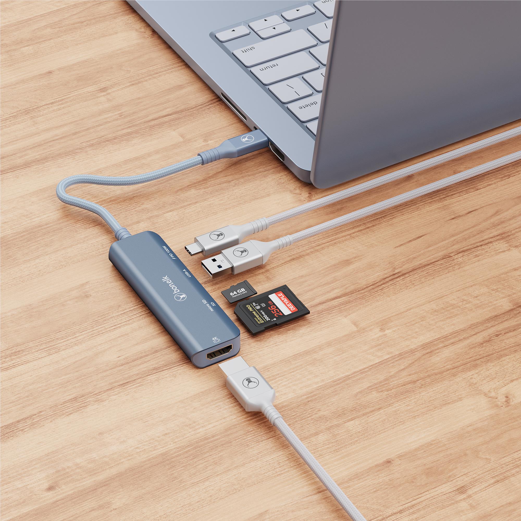 Indigo blue USB-C multiport hub connected to laptop with USB and SD card