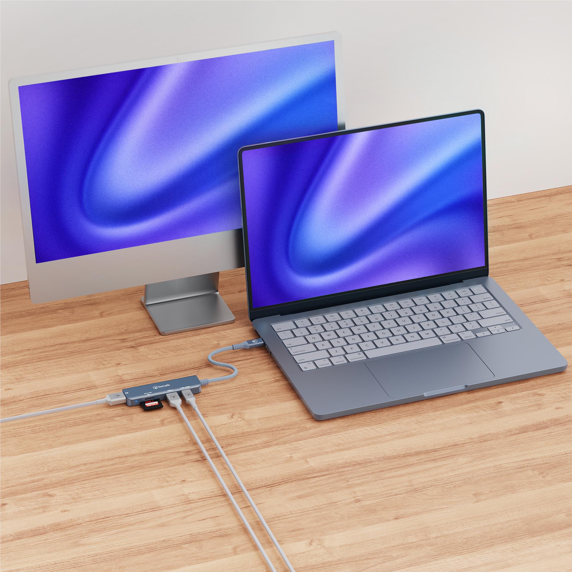 Indigo blue USB-C multiport hub connected to laptop for multi-port use