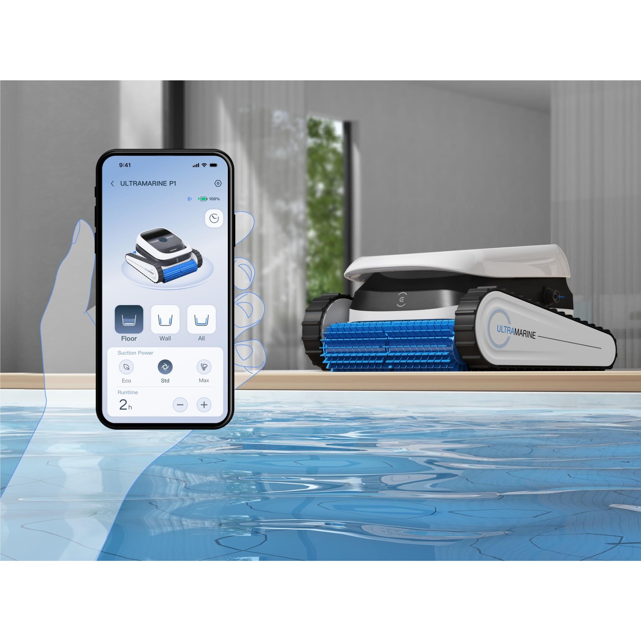 Robot pool cleaner with blue brush roller beside smartphone app screen