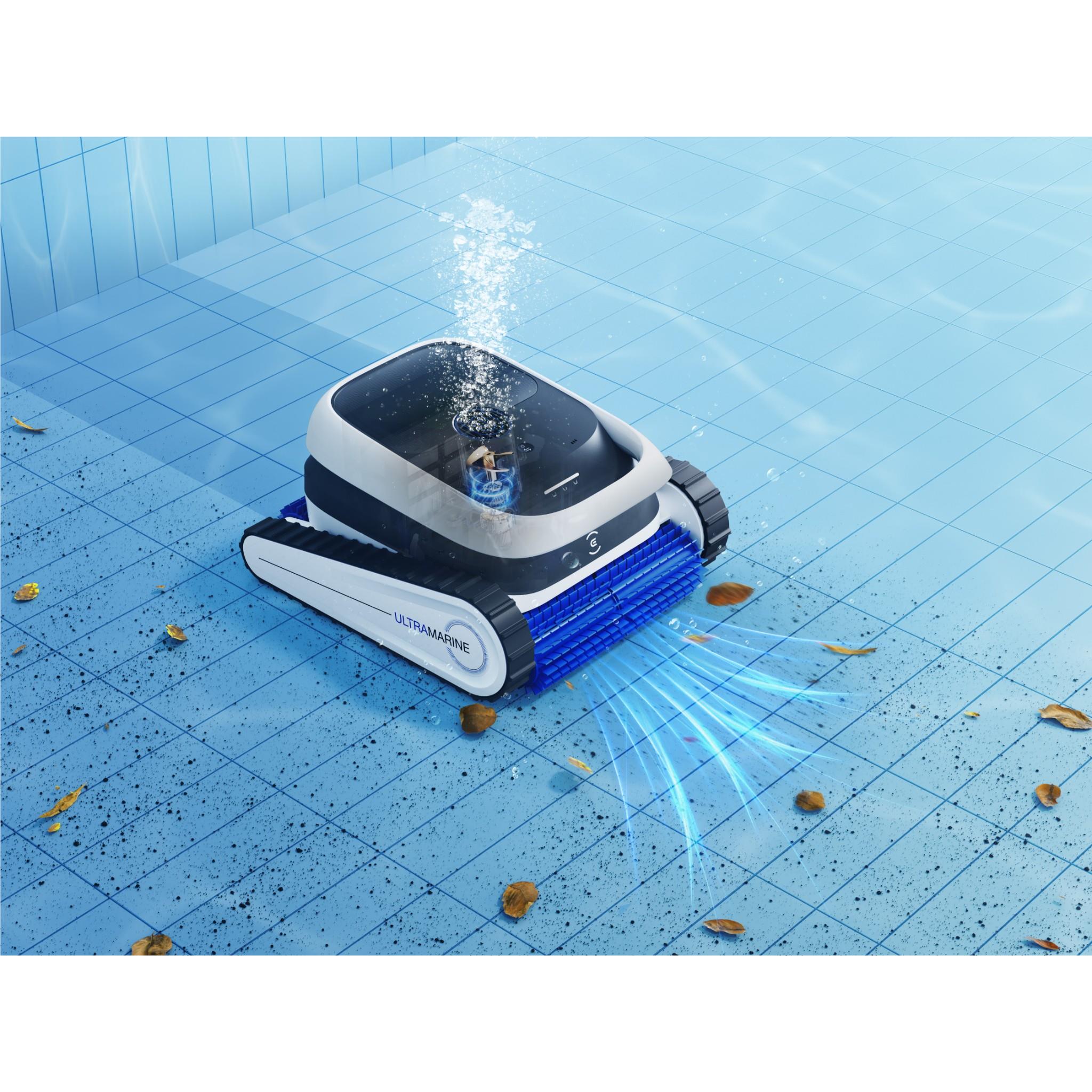 White and blue robot pool cleaner on pool floor with debris and water jets