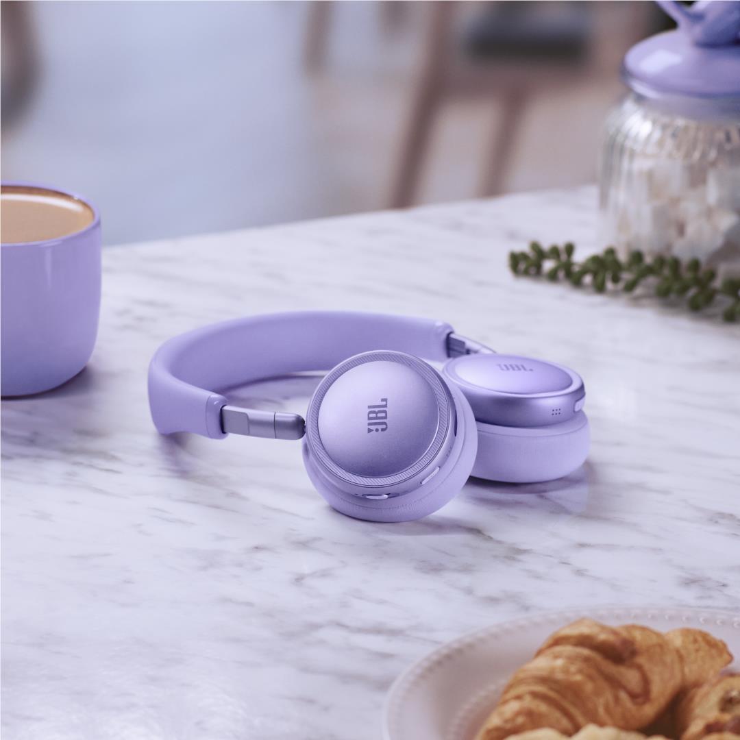 Lavender JBL Live 680NC wireless noise-cancelling headphones on tabletop