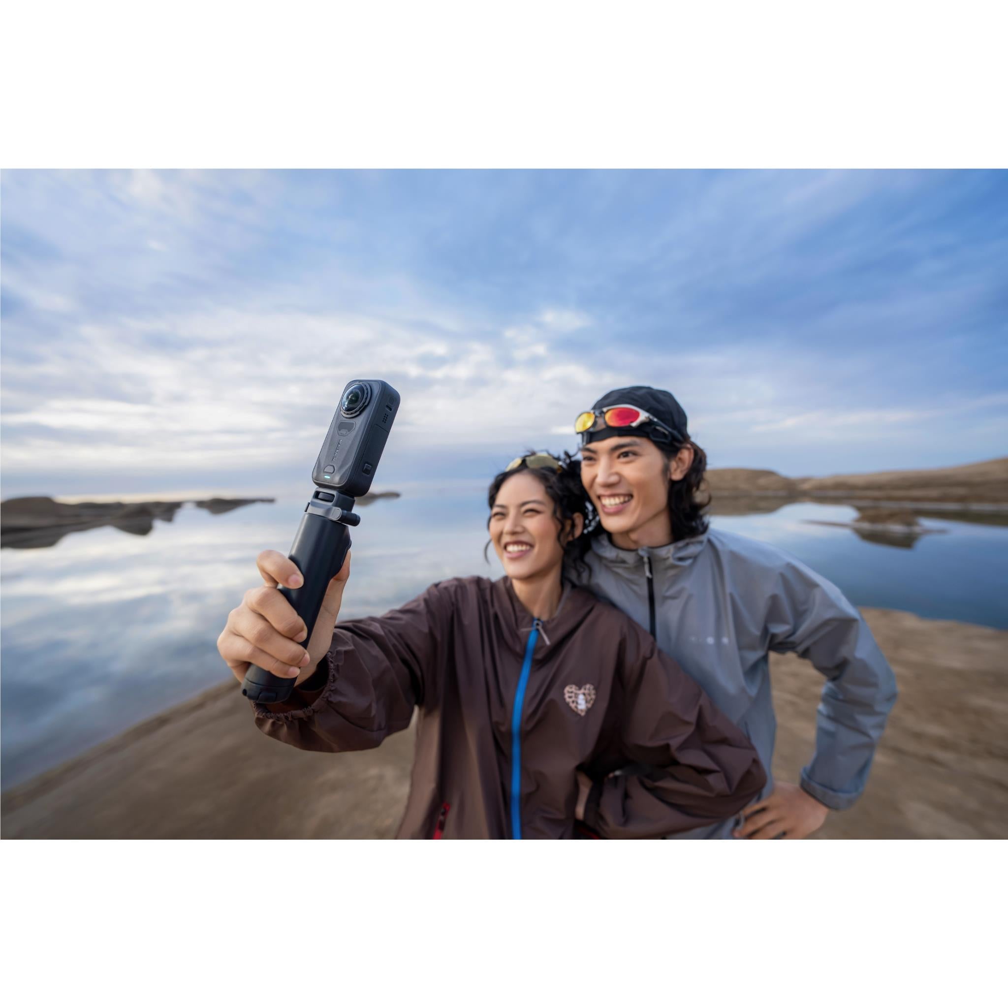 Black Insta360 360 camera on selfie stick