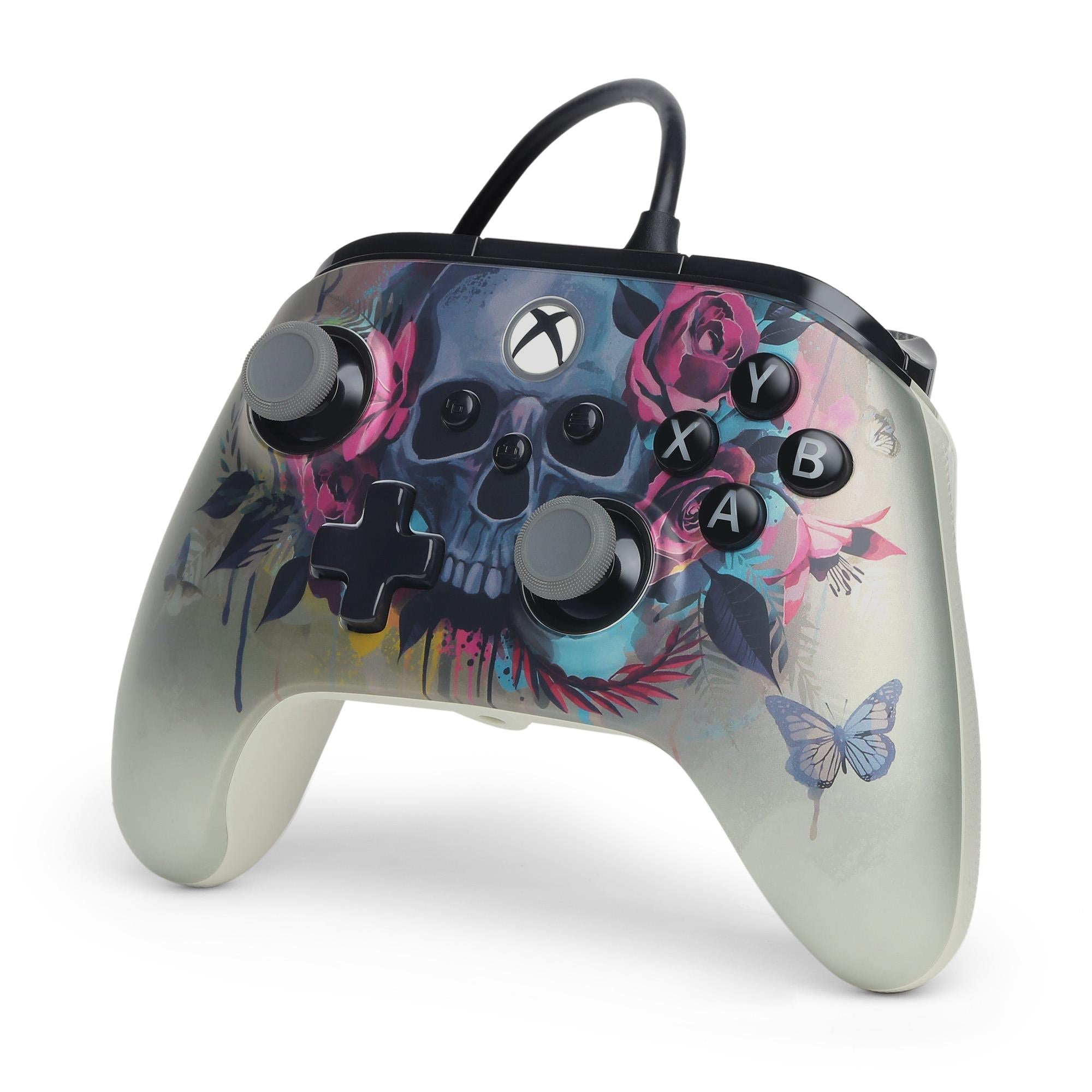Wired Xbox controller with floral skull artwork, butterfly accents, and black thumbsticks