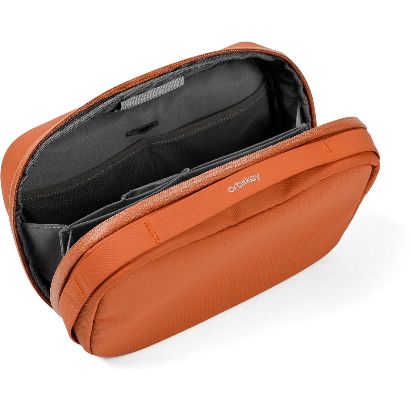Orbitkey tech pouch open, showing gray organizer panels and elastic cable slots