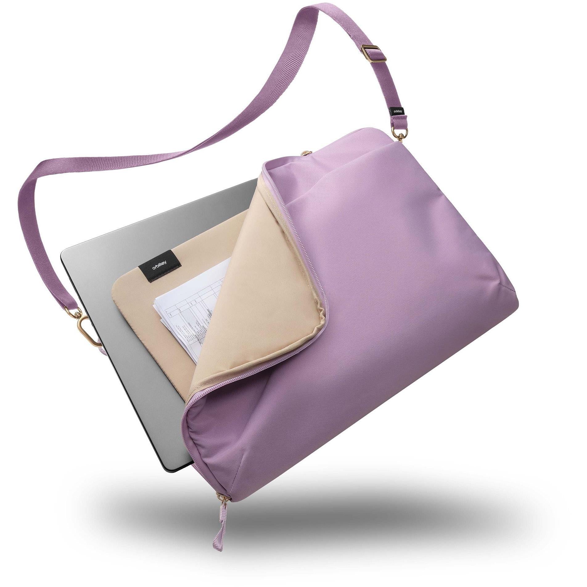 Lilac laptop sleeve with strap open to reveal interior slip pocket